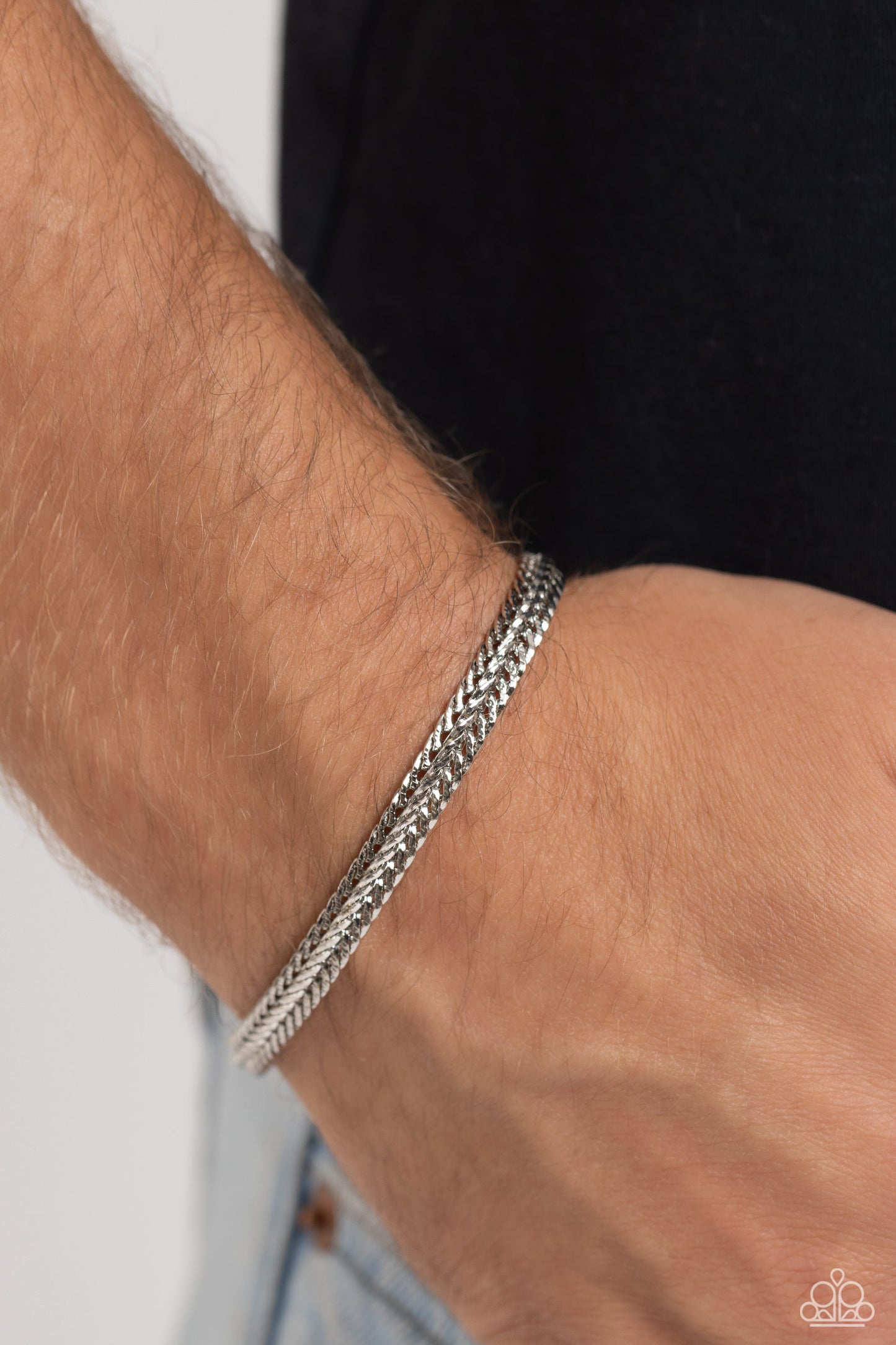 Paparazzi Accessories Cable Train - Silver Intricate silver chains interlock into an edgy centerpiece around the wrist, resulting in a gritty statement piece. Features a magnetic closure. Sold as one individual bracelet. Jewelry