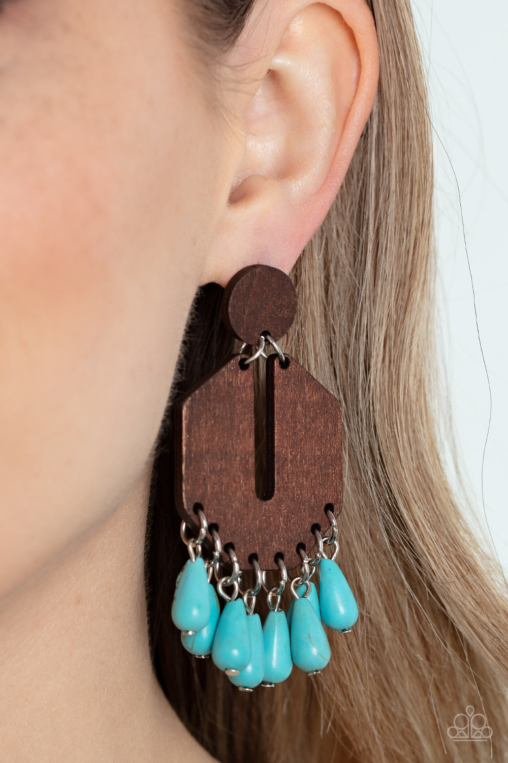 Paparazzi Accessories Western Retreat - Blue Teardrop turquoise stone beads sway from the bottom of an airy and geometric wooden frame that links to a flat wooden circle, resulting in a western inspired fringe. Earring attaches to a standard post fitting.