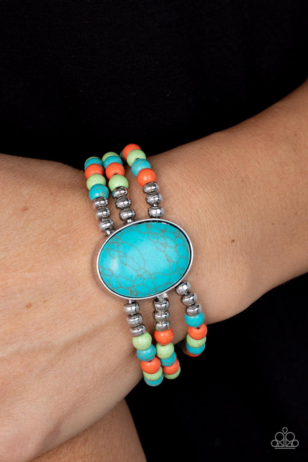 Paparazzi Accessories Stone Pools - Multi Layers of turquoise, green, and orange stone beads are threaded along stretchy bands that connect to a stunning oval turquoise stone, creating an extraordinary statement piece around the wrist. Sold as one individ