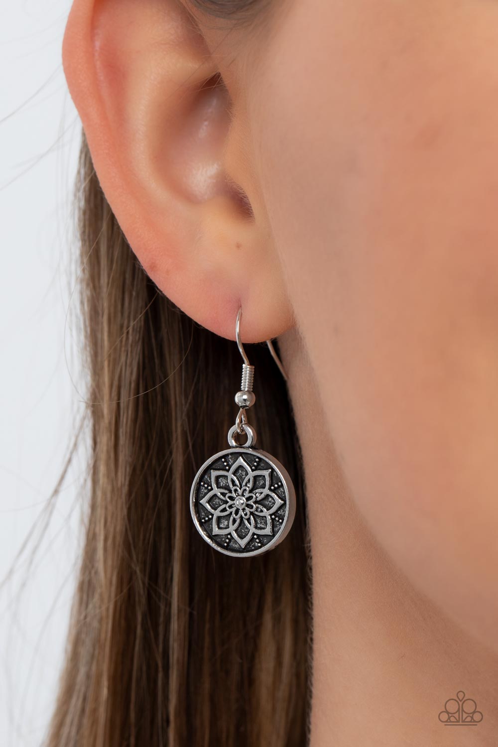 Paparazzi Accessories Western Zen - Black A collection of silver discs, embellished with intricate mandala-like designs, dances along a thick silver chain, with a pair of polished black stone rings adding a pop of color to the rustic design. Features an a