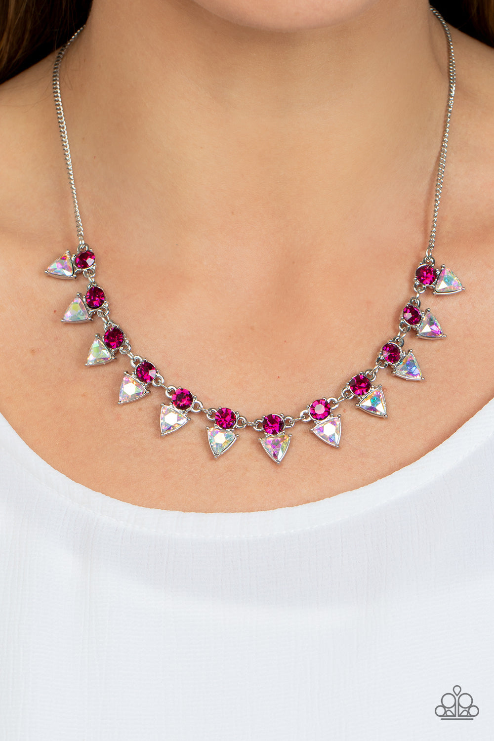 Paparazzi Accessories Razor-Sharp Refinement - Pink Solitaire pink rhinestones sparkle atop iridescent prism-like gems below the collar, linking into a sharp-looking statement piece. Features an adjustable clasp closure. Due to its prismatic palette, colo