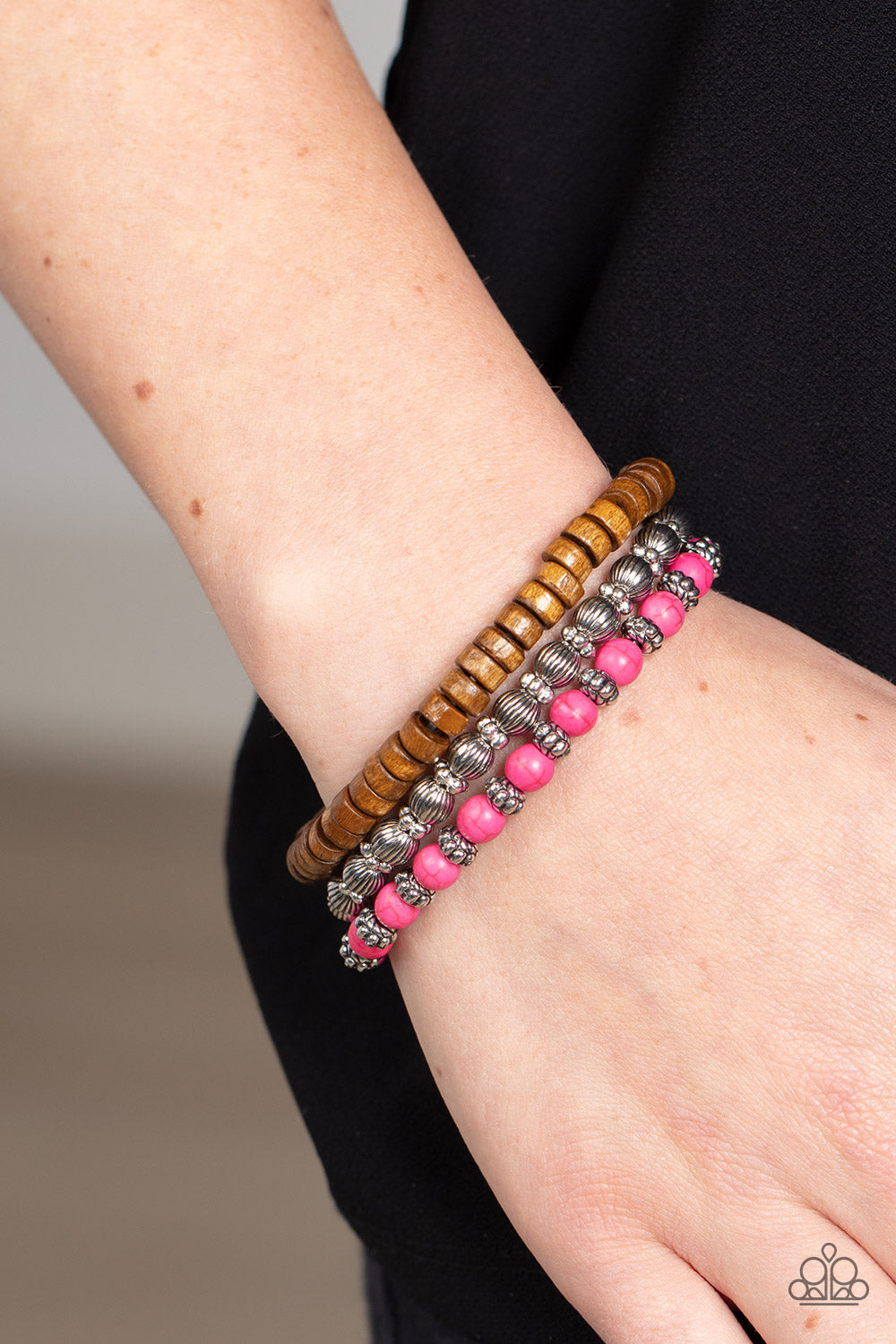 Paparazzi Accessories ESCAPADE Route - Pink Vivacious pink stone beads, wooden beads, and silver antiqued beads are threaded along elastic stretchy bands. Sprinkled between the colorful beads are dainty silver-studded flower beads for a whimsical finish.