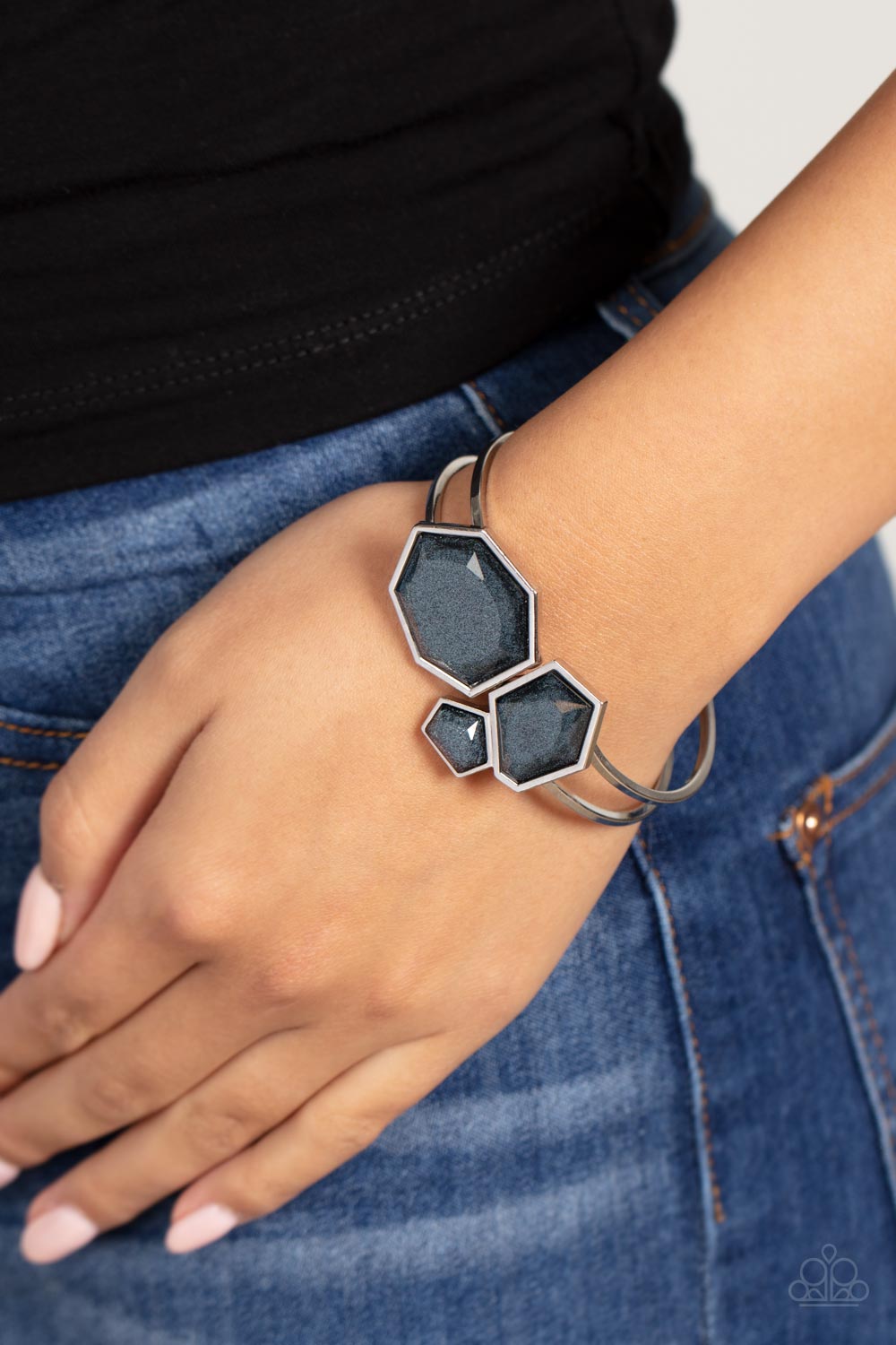 Paparazzi Accessories Tourist TRAPEZOID - Multi Three glassy geometric beads with sharp angular edges and faceted surfaces meet at the ends of curved bands of silver to create a cuff. Glittery shimmer runs through each of the rich black gems, adding a hin