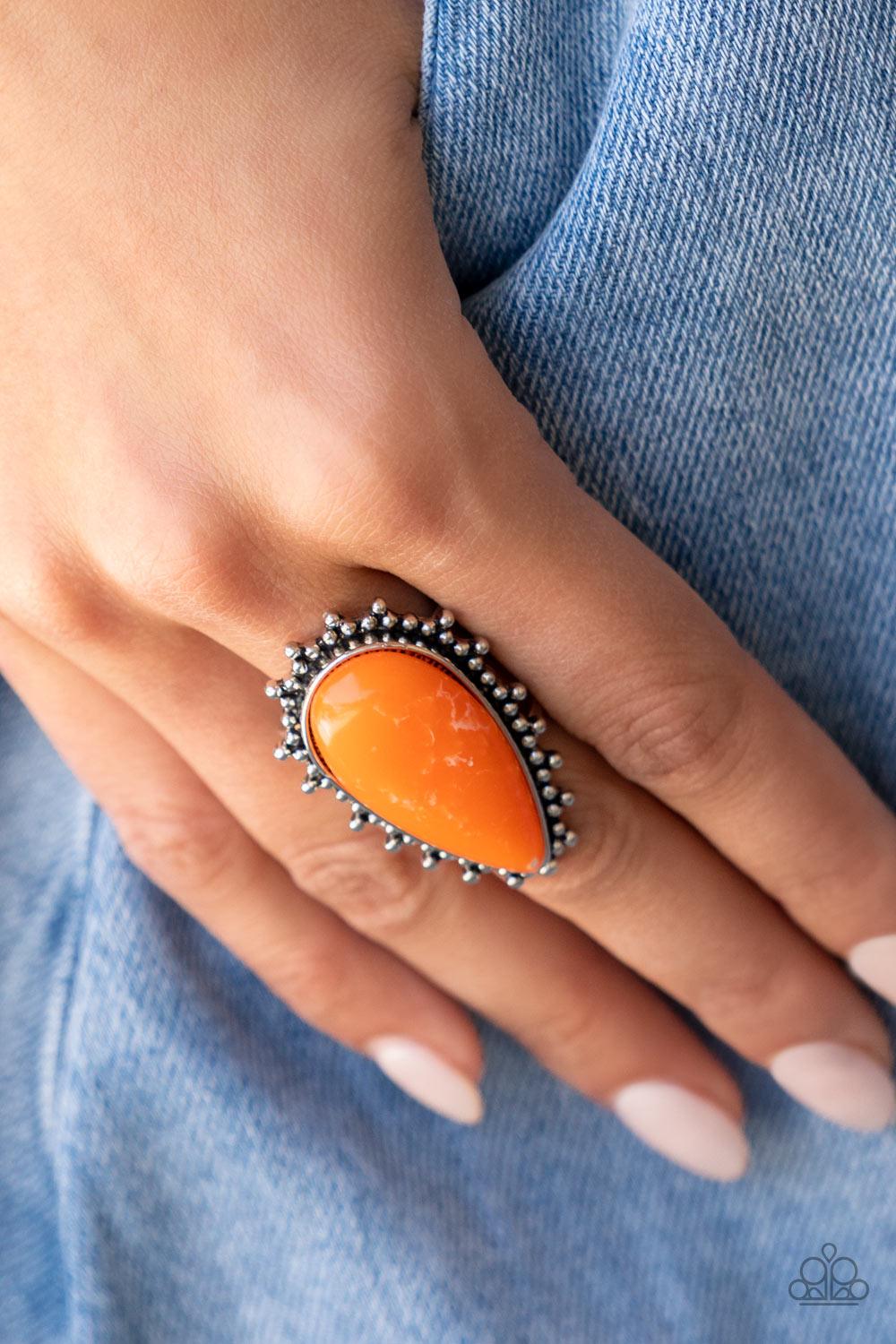Paparazzi Accessories Down-to-Earth Essence - Orange Chiseled into a tranquil teardrop, a refreshing orange stone is pressed into the center of a studded silver frame for an earthy ensemble. Features a stretchy band for a flexible fit. Sold as one individ