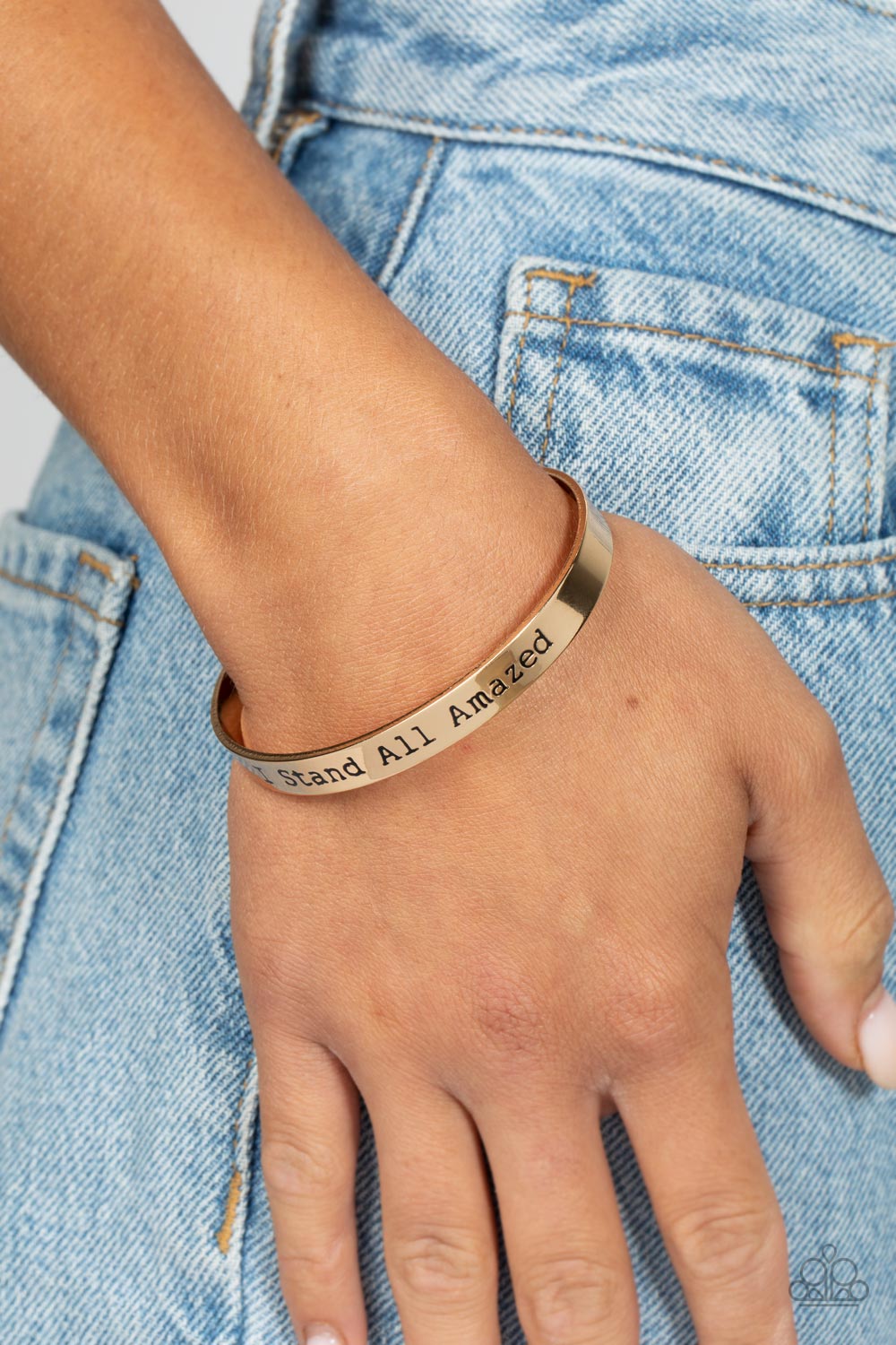 Paparazzi Accessories I Stand All Amazed - Gold A simplistic, shiny, gold cuff is stamped with the phrase "I Stand All Amazed," for a divine, light-catching design across the wrist. Sold as one individual bracelet. Jewelry