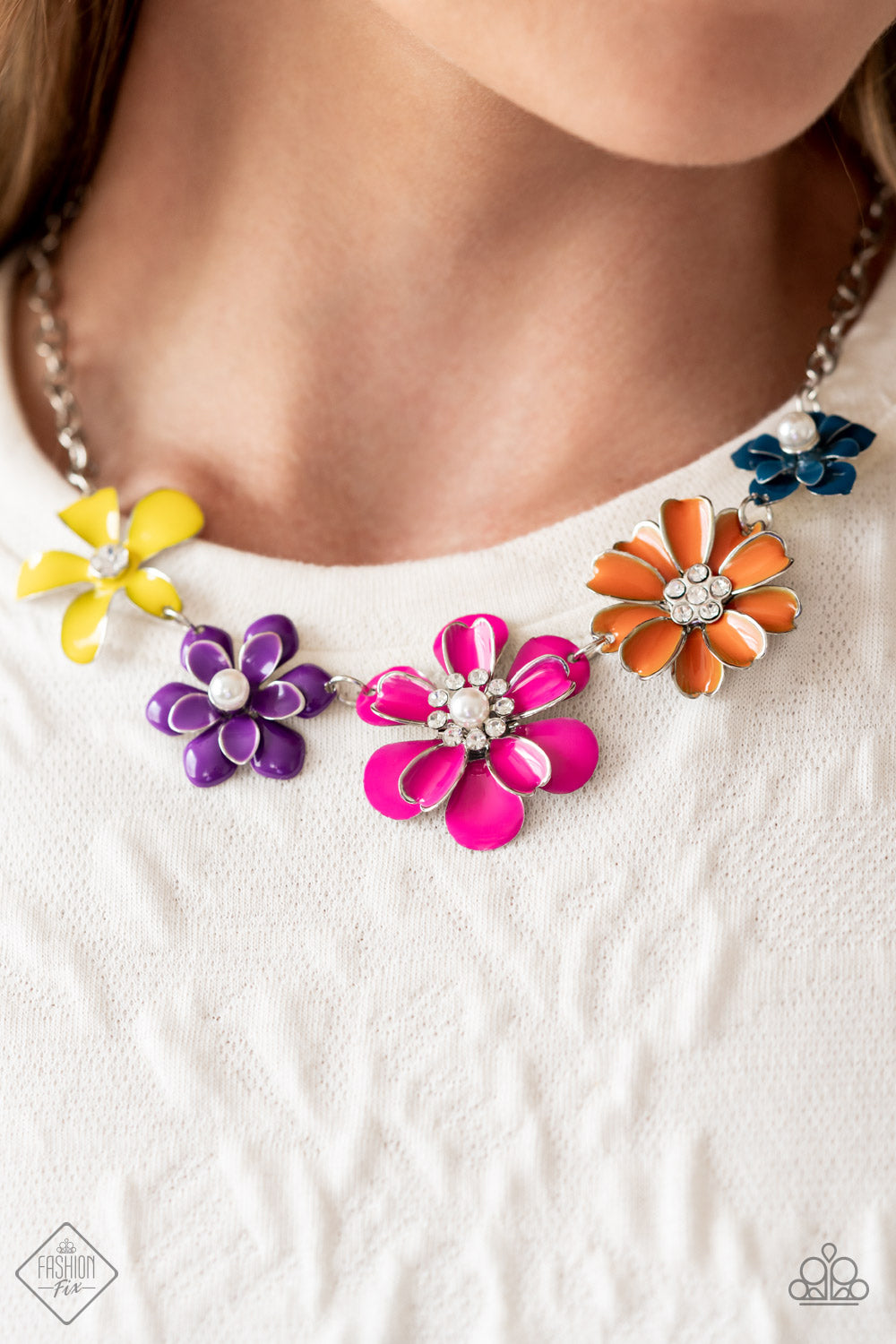 Paparazzi Accessories Floral Reverie - Multi A row of colorful flowers blooms to life along the collar, creating a vibrant statement piece. Each flower features a different centerpiece, flawlessly sprinkling the design with whimsical sparkle and shimmery