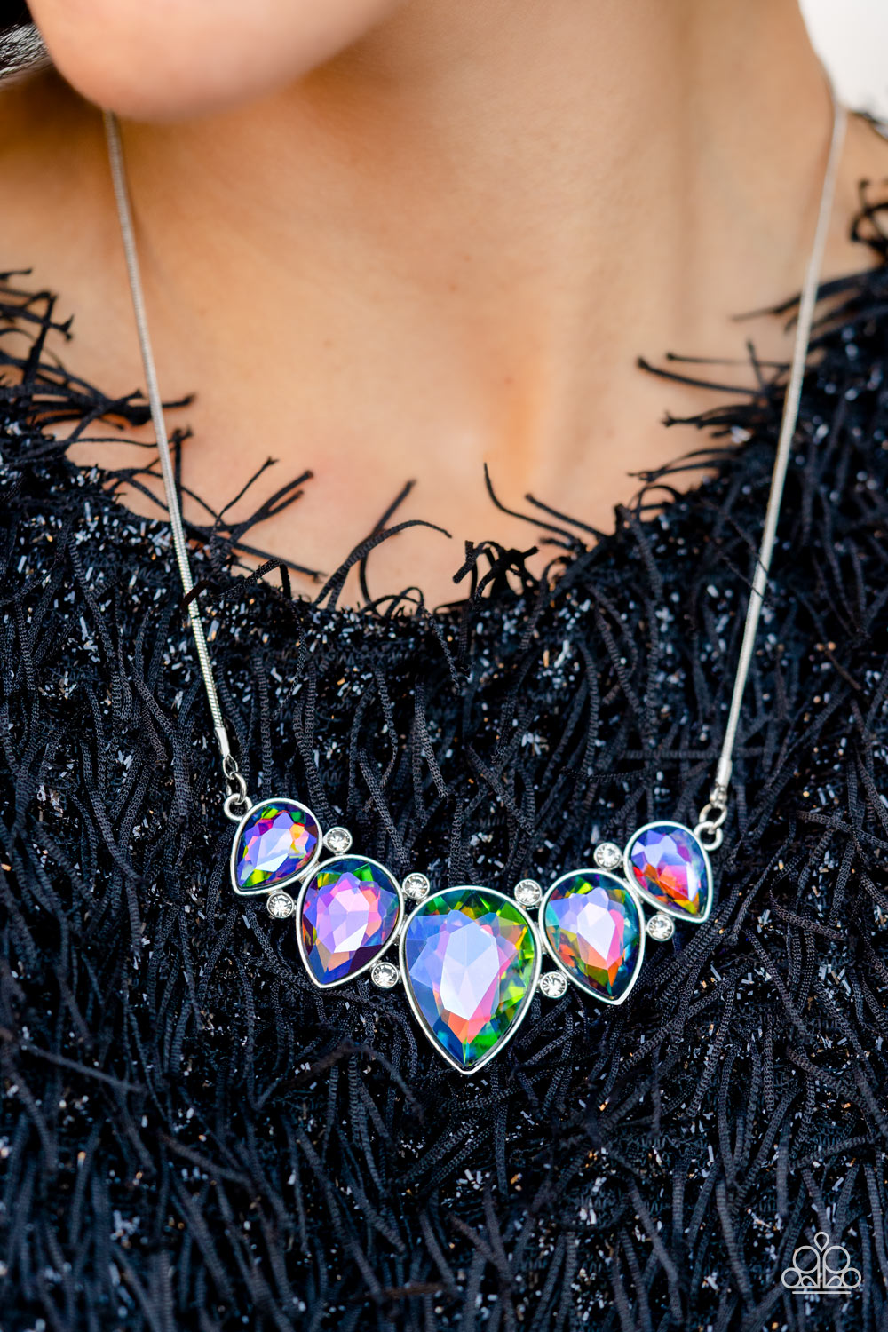 Paparazzi Accessories Regally Refined - Multi Featuring a stellar UV shimmer, dramatic teardrop gems, gliding from a sleek, silver snake chain, are pressed into high-sheen silver casings, creating a colorful fringe below the collar. Linking each teardrop