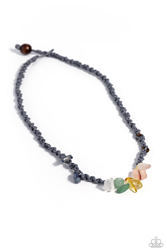 Paparazzi Accessories Chiseled Craving - Silver Braided gray cording knots around a chiseled, multicolored collection of stones, including amethyst, jade, lapis, Tiger's eye, and others, for an urban explosion of color below the collar. Features a button