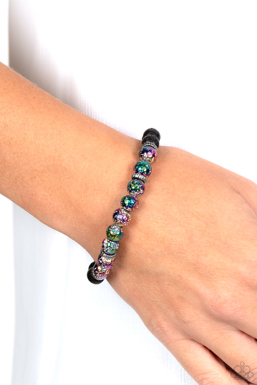 Paparazzi Accessories LAVA Story - Multi A stellar assortment of oil spill lava rock beads, silver accents, and black lava rock beads are threaded along an elastic stretchy band around the wrist for an urban flair. Due to its prismatic palette, color may