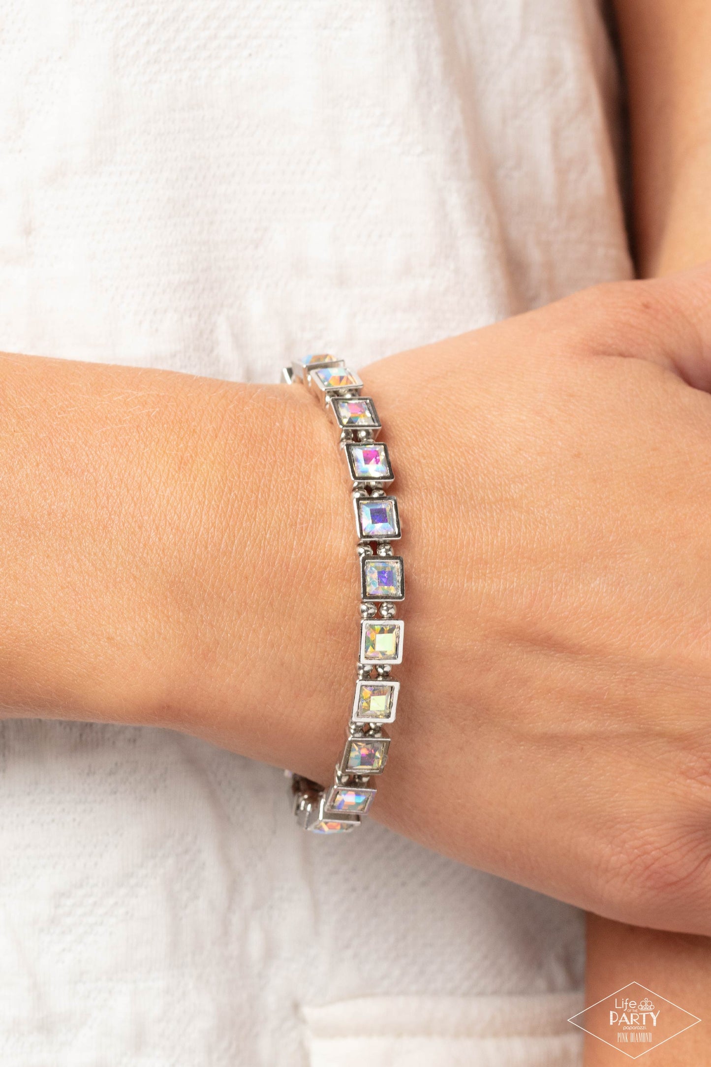 Paparazzi Accessories A GLAM Of Few Words - Multi Chiseled into elegant squares, glittery iridescent gems are nestled into sleek silver frames and threaded along elastic stretchy bands for a refined look. Due to its prismatic palette, color may vary. Sold