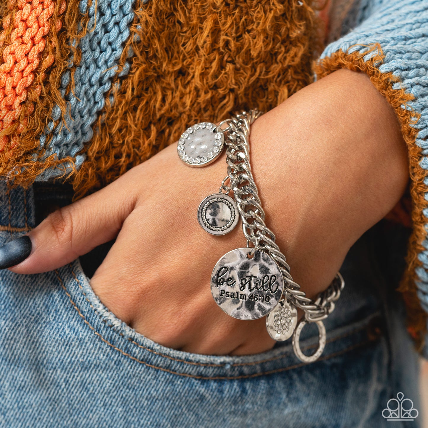Paparazzi Accessories GLITTER and Grace - White Gliding from a thick silver curb chain, a collection of refined charms add some texture and shimmer to this monochromatic mash-up. An oversized, hammered disc is stamped with the phrase "be still" with the s