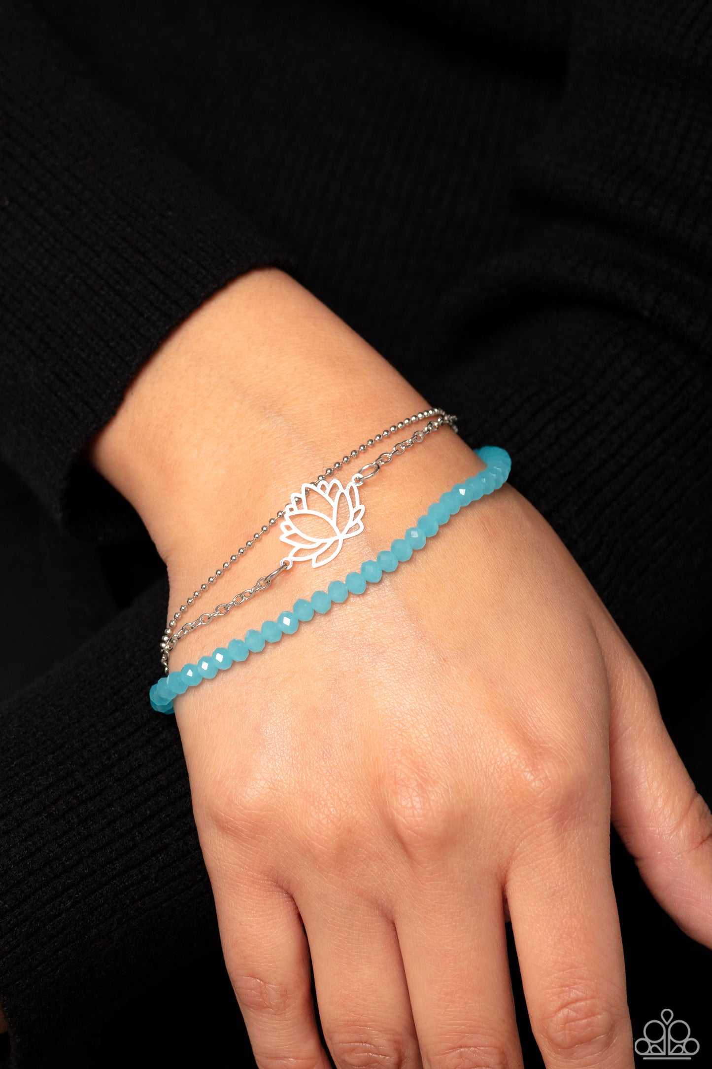 Paparazzi Accessories A LOTUS Like This - Blue Faceted blue beads combine with a dainty silver chain, and a dainty silver ball chain for a colorful display around the wrist. Falling from the classic chain, an airy silver lotus blooms, adding a whimsical f