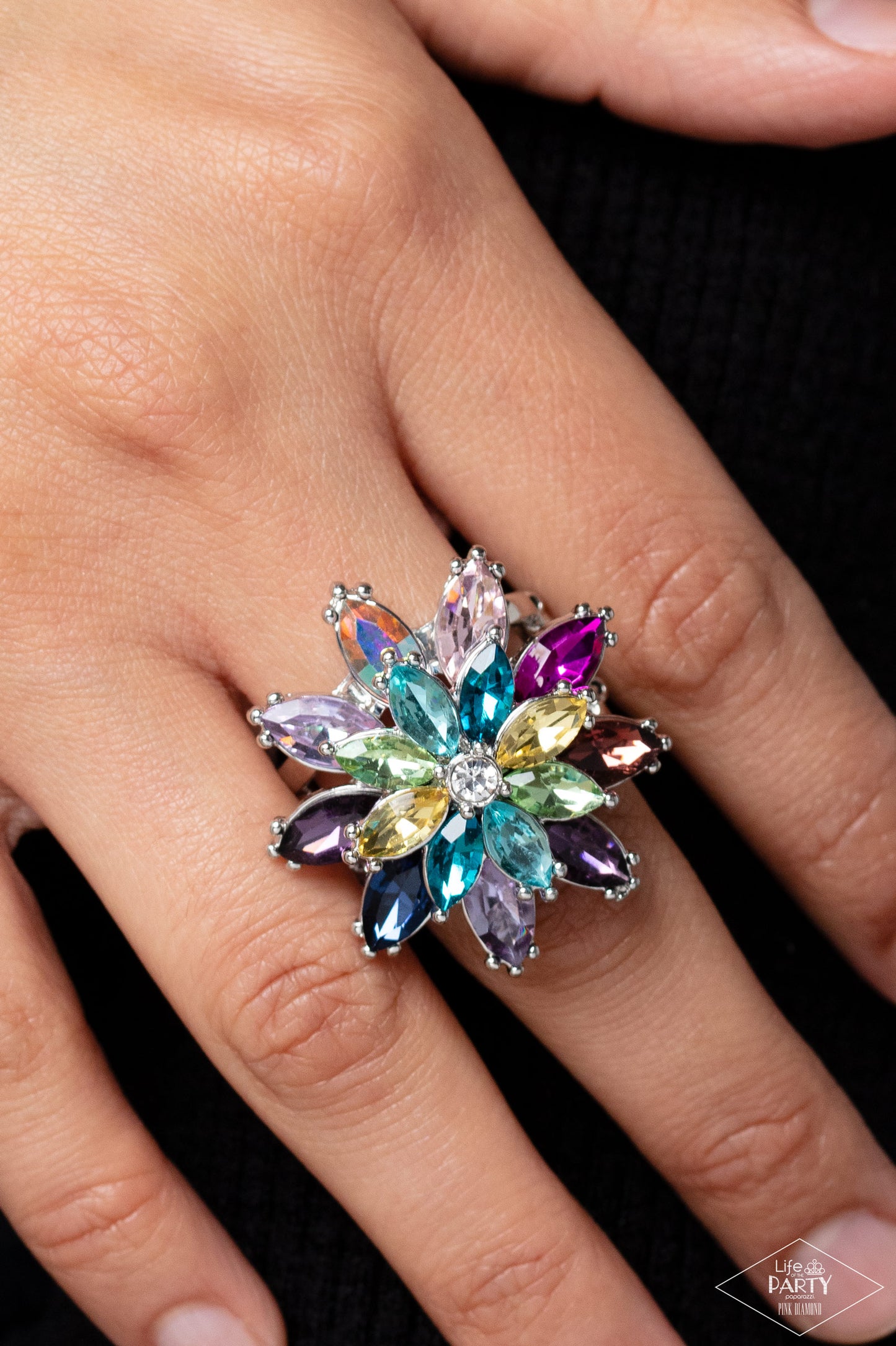 Paparazzi Accessories Am I GLEAMing? - Multi Glittery colorful rhinestones in the shape of petals stack into a glamorous floral frame atop the finger, creating a blinding centerpiece. Features a stretchy band for a flexible fit. Due to its prismatic palet