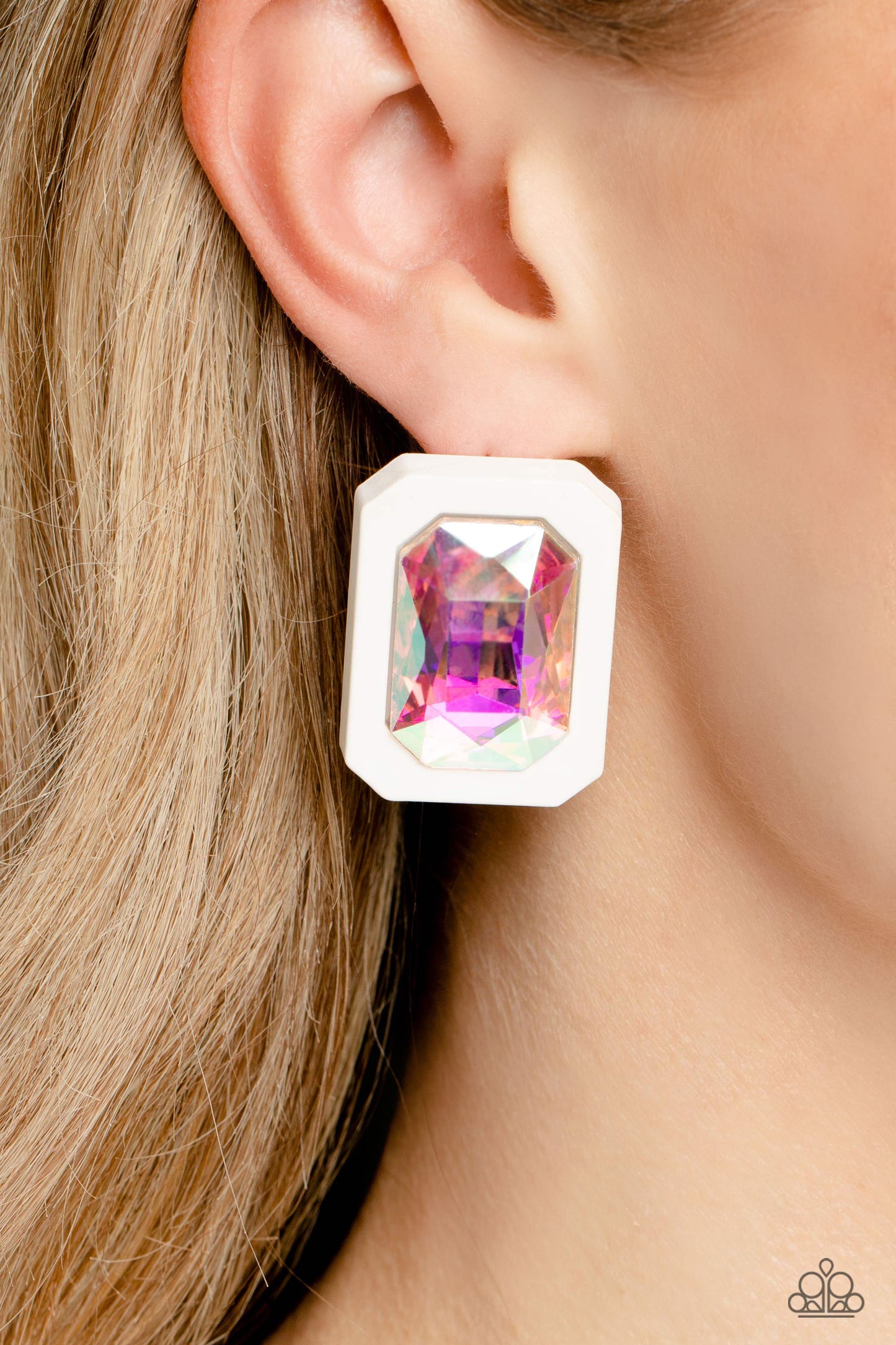 Paparazzi Accessories Edgy Emeralds - Multi 2 Standing out against a white rubber backdrop, an oversized, faceted emerald-cut iridescent gem shimmers and shines for an edgy sparkle against the ear. Earring attaches to a standard post fitting. Due to its p