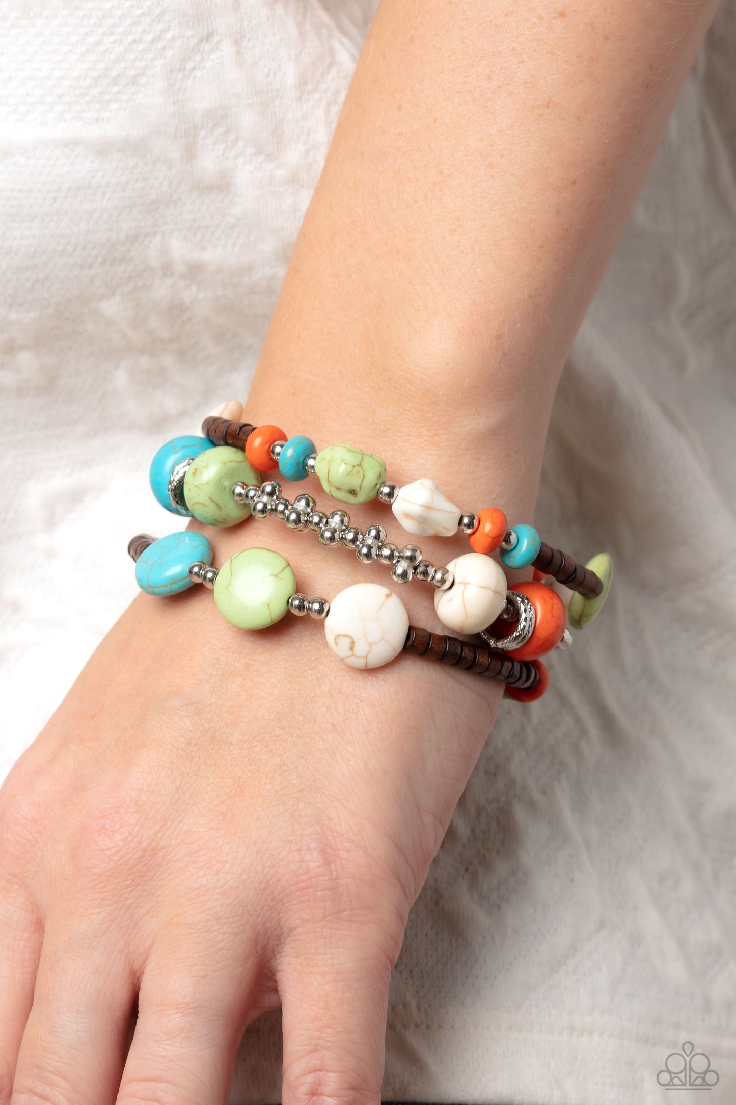 Paparazzi Accessories Operation Outdoors - Multi An earthy collection of brown wooden beads, classic silver beads and accents, and turquoise, orange, white, and apple green stones in varying sizes are threaded along invisible wires to create three bands t