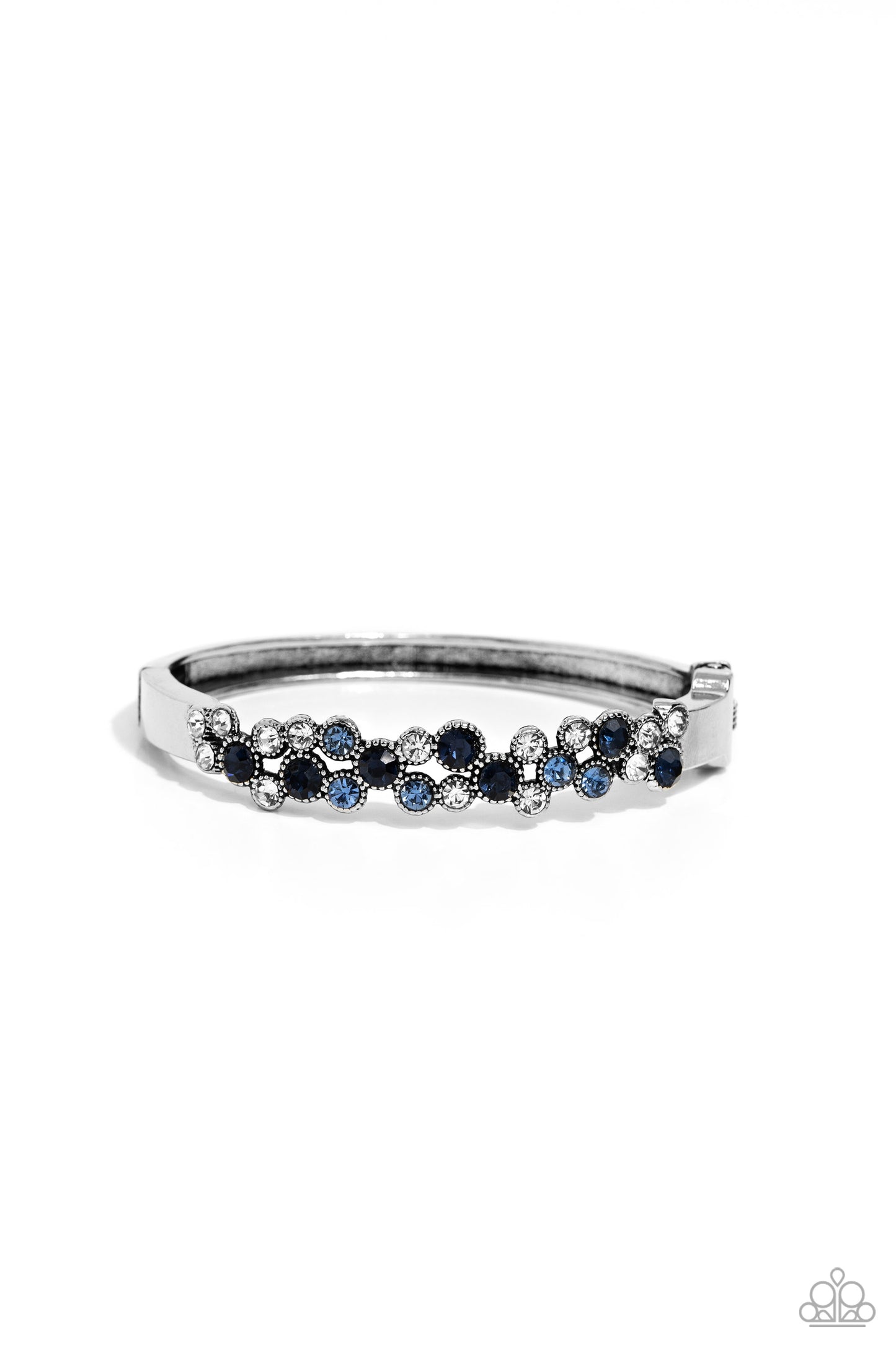 Paparazzi Accessories Big City Bling - Blue Featuring a crisscross pattern, a studded, framed collection of gems in varying sizes in shades of blue and white coalesce the top of a thick, silver bracelet for a pop of shimmery color atop the wrist. Features