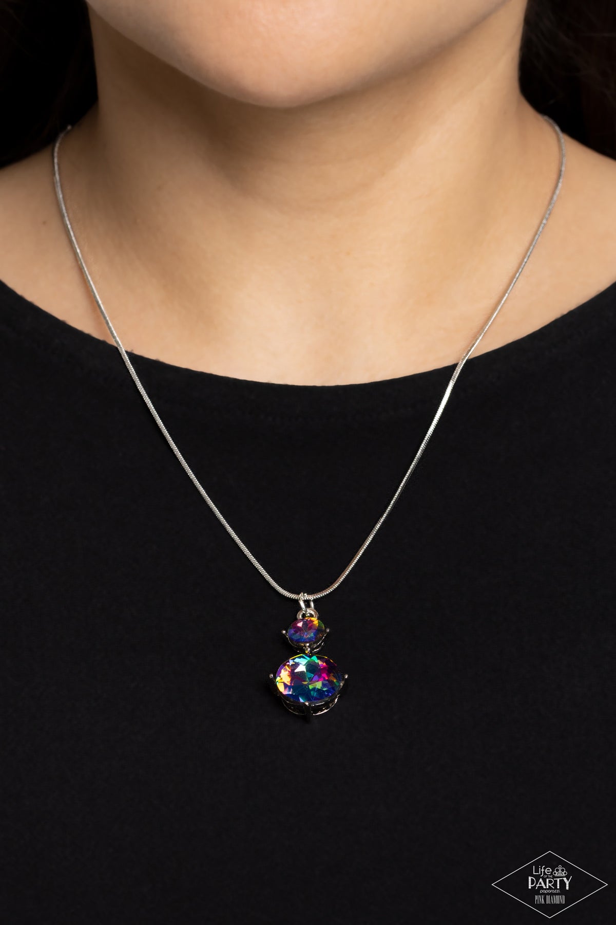 Paparazzi Accessories Top Dollar Diva - Multi Nestled inside classic silver prongs, two oversized rhinestones, featuring a UV shimmer, slide along a dainty silver snake chain, creating a dramatic pendant below the collar. Features an adjustable clasp clos