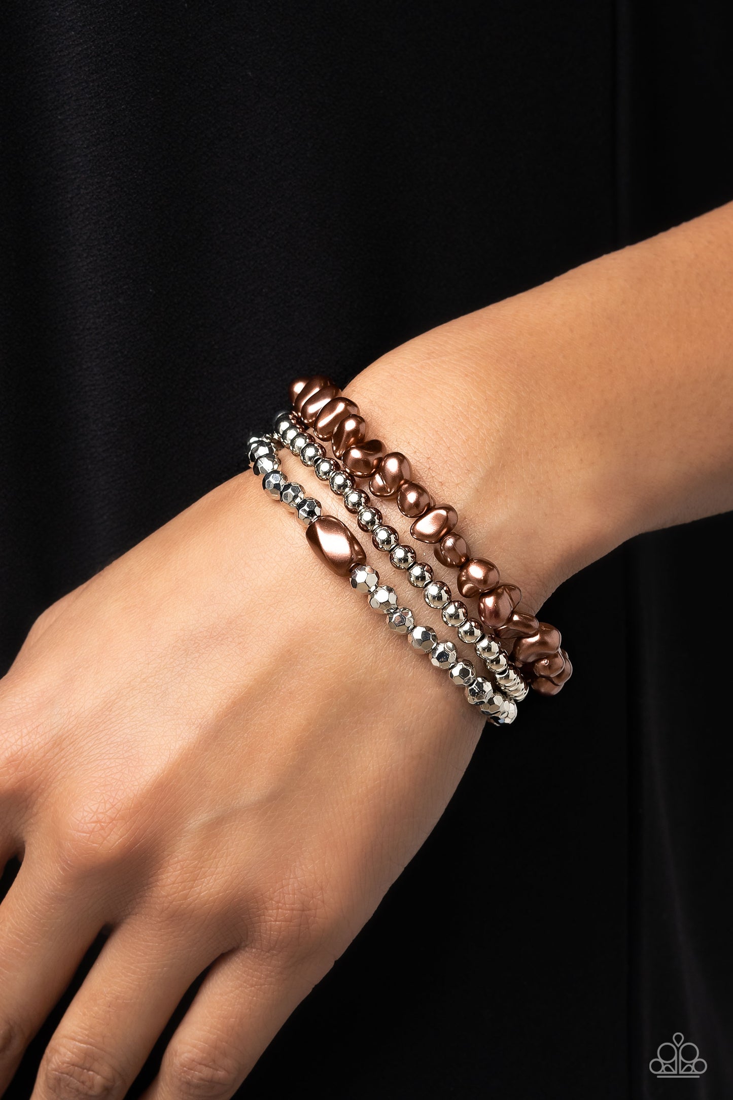 Paparazzi Accessories Effulgent Exchange - Brown Coalescing into a light-reflecting stack up the wrist, silver beads, baroque brown pearl beads, and faceted silver beads with two brown pearl beads wrap around the wrist on elastic stretchy bands for a fash