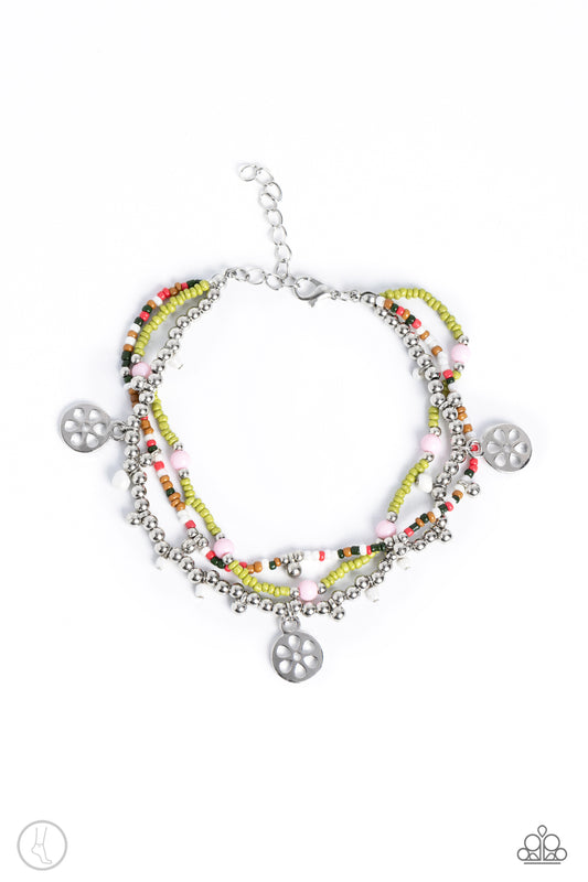 Paparazzi Accessories Surfing Safari - Green Infused with hints of Leek Green, Macchiato, coral and olive seed beads, a mismatched collection of silver beads, stenciled silver floral discs, dainty white pearl seed beads and baby pink beads are threaded al