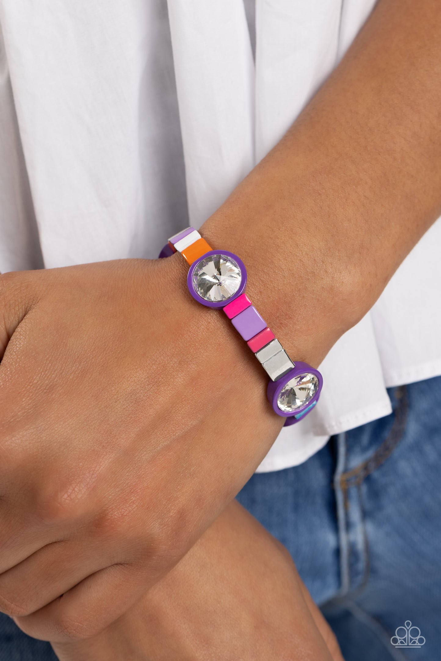 Paparazzi Accessories Multicolored Madness - Purple Strung along elastic stretchy bands, a bodacious collection of silver accents, and varying metallic accents dipped in colorful shades encircle the wrist. Sporadically infused between the colorful display