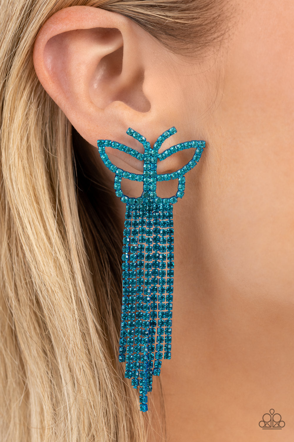Paparazzi Accessories Billowing Butterflies - Blue Glassy blue rhinestones, encrusted along the front of a blue butterfly frame, create a whimsical centerpiece. Staggered rows of different blue rhinestones pressed in delicate blue square fittings cascade