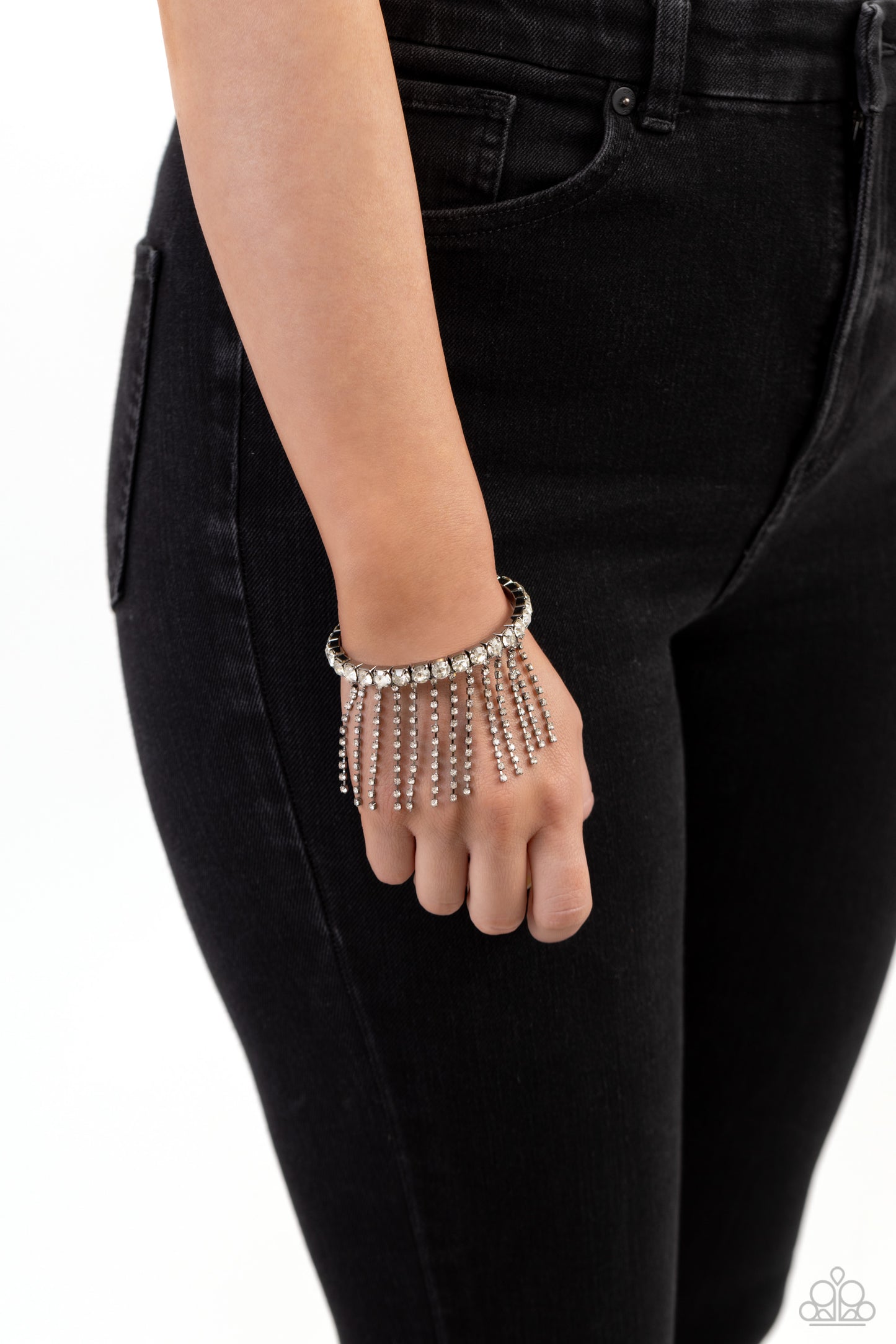 Paparazzi Accessories Stardust Shower - Black Pressed in thick gunmetal square fittings, white gems encircle the wrist to create a glittery cuff. Rows of dainty white rhinestones, pressed in delicate gunmetal square fittings, cascade from the sparkly cuff