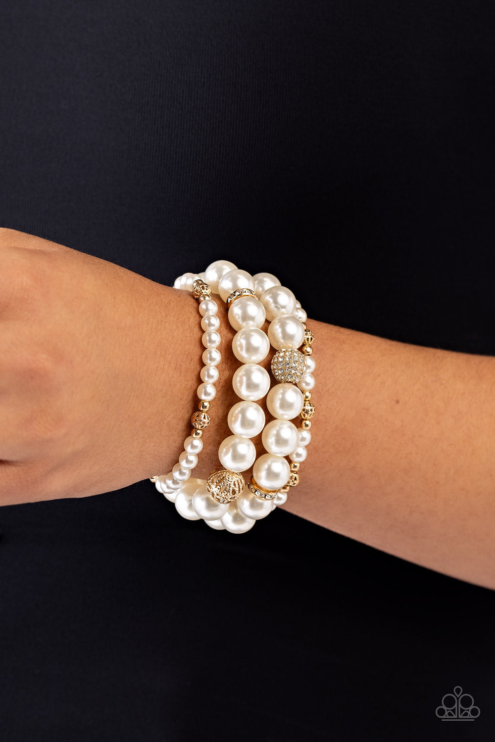 Paparazzi Accessories Vastly Vintage - Gold Infused with white rhinestone-encrusted gold beads, white rhinestone-encrusted discs, and textured gold beads, a bubbly collection of mismatched white pearls are threaded along stretchy bands around the wrist fo