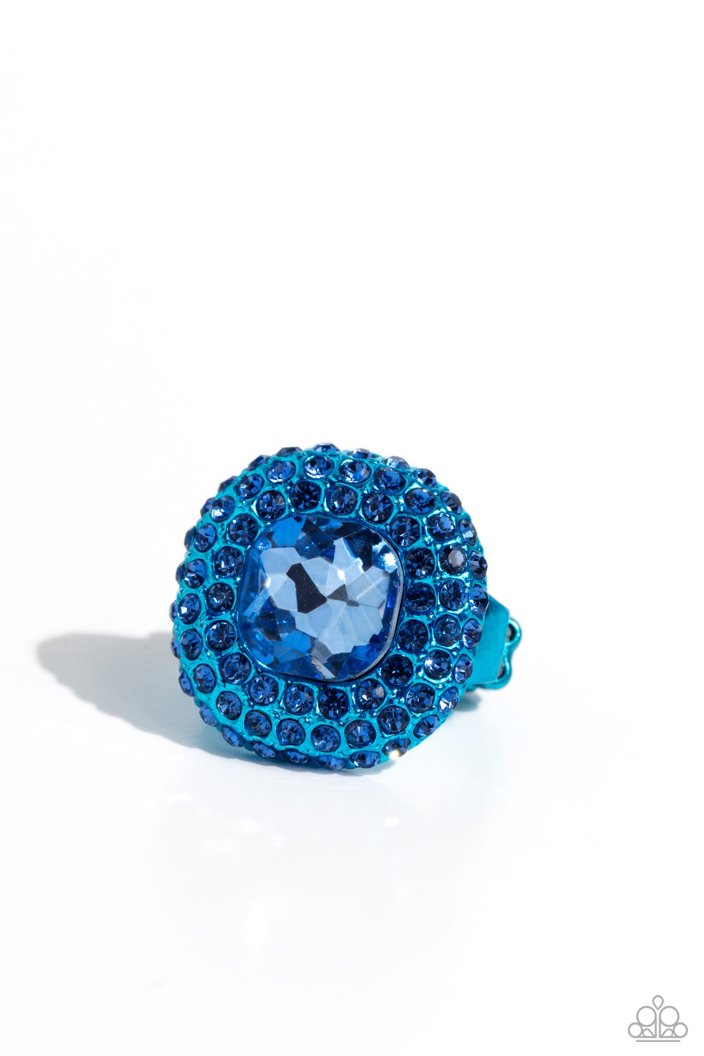 Paparazzi Accessories Glistening Grit - Blue Featuring a regal square cut, an oversized Persian Jewel gem nestles inside a rounded square blue metallic frame encrusted in glassy blue rhinestones for a dramatically glamorous look. Features a dainty stretch