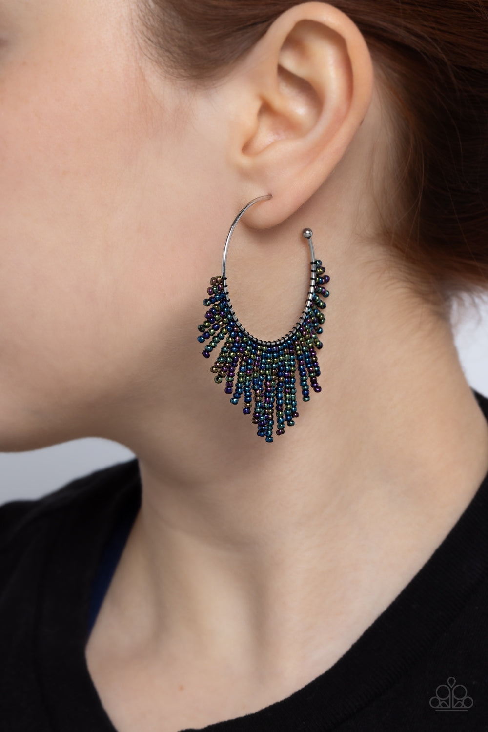 Paparazzi Accessories Tailored Tassel - Multi Cascading strands of oil spill seed beads stream out from the bottom of a classic silver hoop, resulting in a flirtatiously tasseled look. Earring attaches to a standard post fitting. Hoop measures approximate