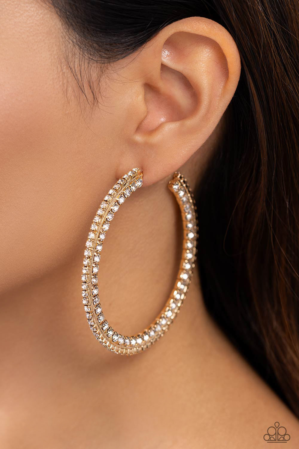 Paparazzi Accessories Scintillating Sass - Gold Glittery white rhinestones are encrusted along the front and side of a textured tread-like oversized gold hoop for a sassy finish. Earring attaches to a standard post fitting. Hoop measures 2 1/2" in diamete