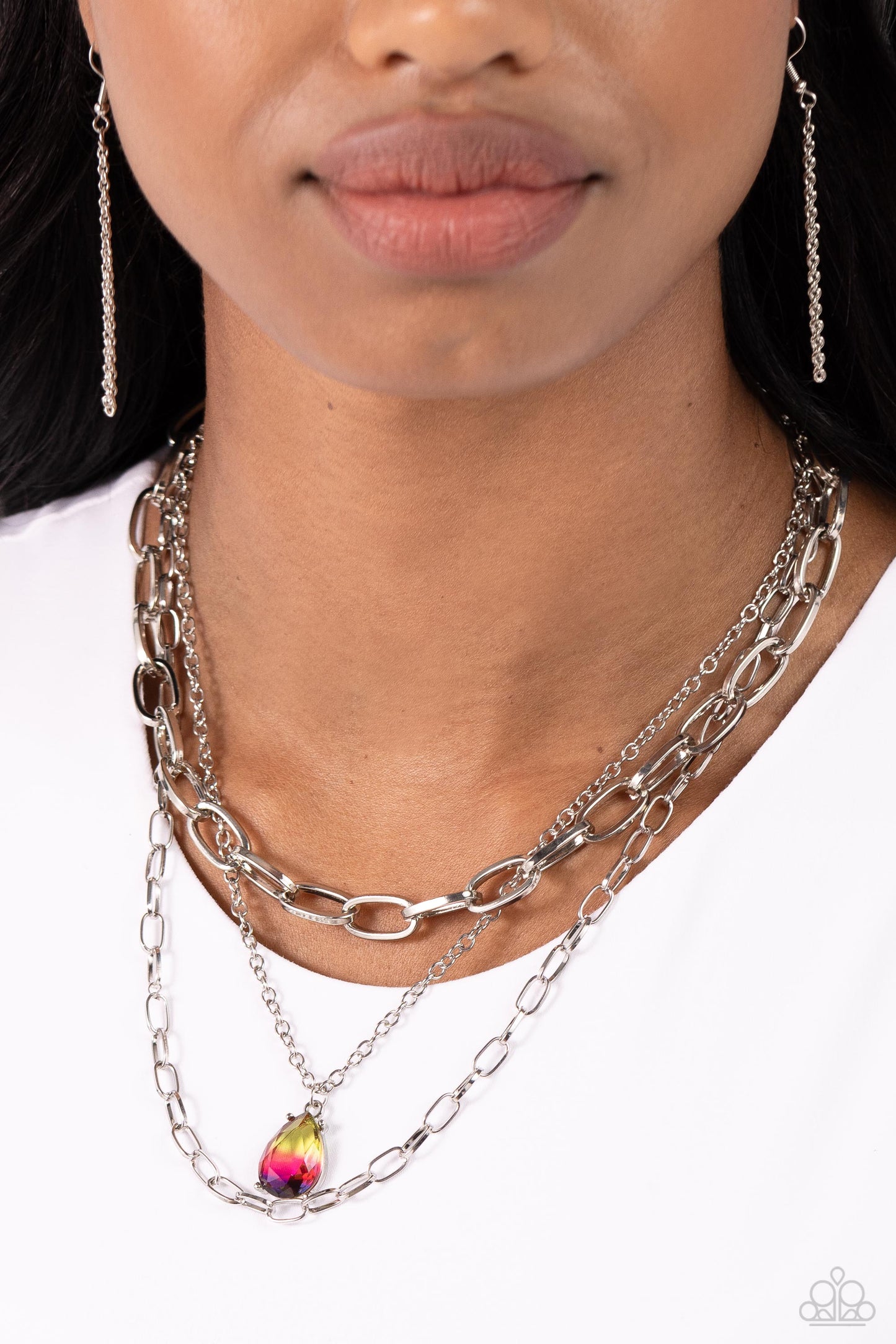 Paparazzi Accessories Teardrop Tiers - Multi A trio of mismatched silver chains coalesces down the neckline for a monochromatic masterpiece. Strung on the middle chain, a pronged glassy teardrop with an ombré effect of yellow to pink to purple stands out