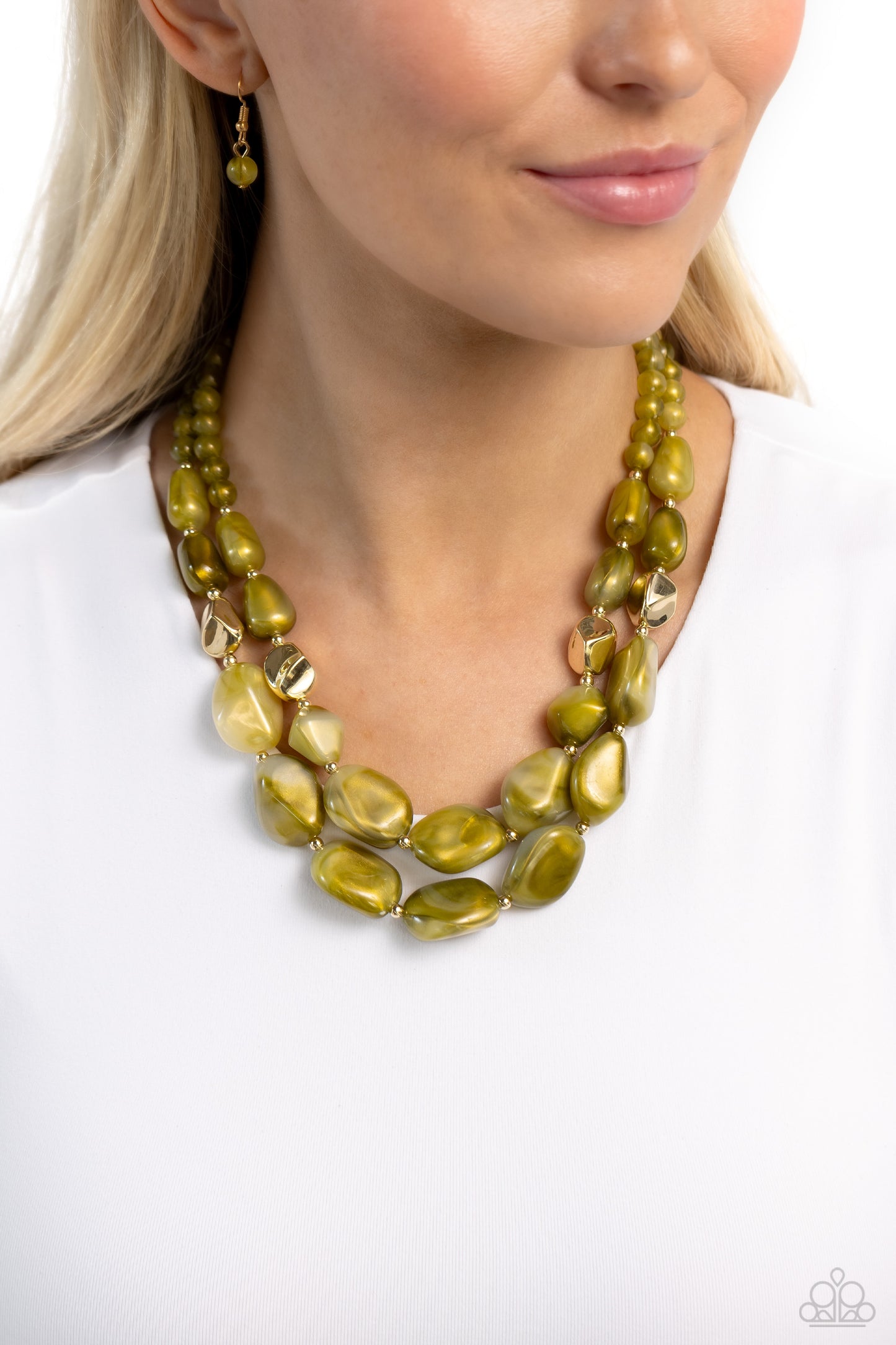 Paparazzi Accessories Seize the Statement - Green Varying in shape and opacity, a refreshing collection of sparkle-infused green beads layer below the collar for a boldly colorful look. Accents of faceted gold beads and gold studs are infused throughout t