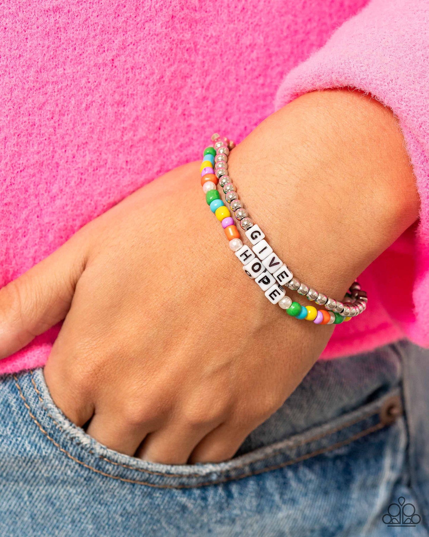 Paparazzi Accessories Giving Hope - Multi Threaded along stretchy bands around the wrist, a strand of silver beads with a silver heart bead combines with a multicolored strand of seed beads and glossy white pearls to create a stunning pop of color. White