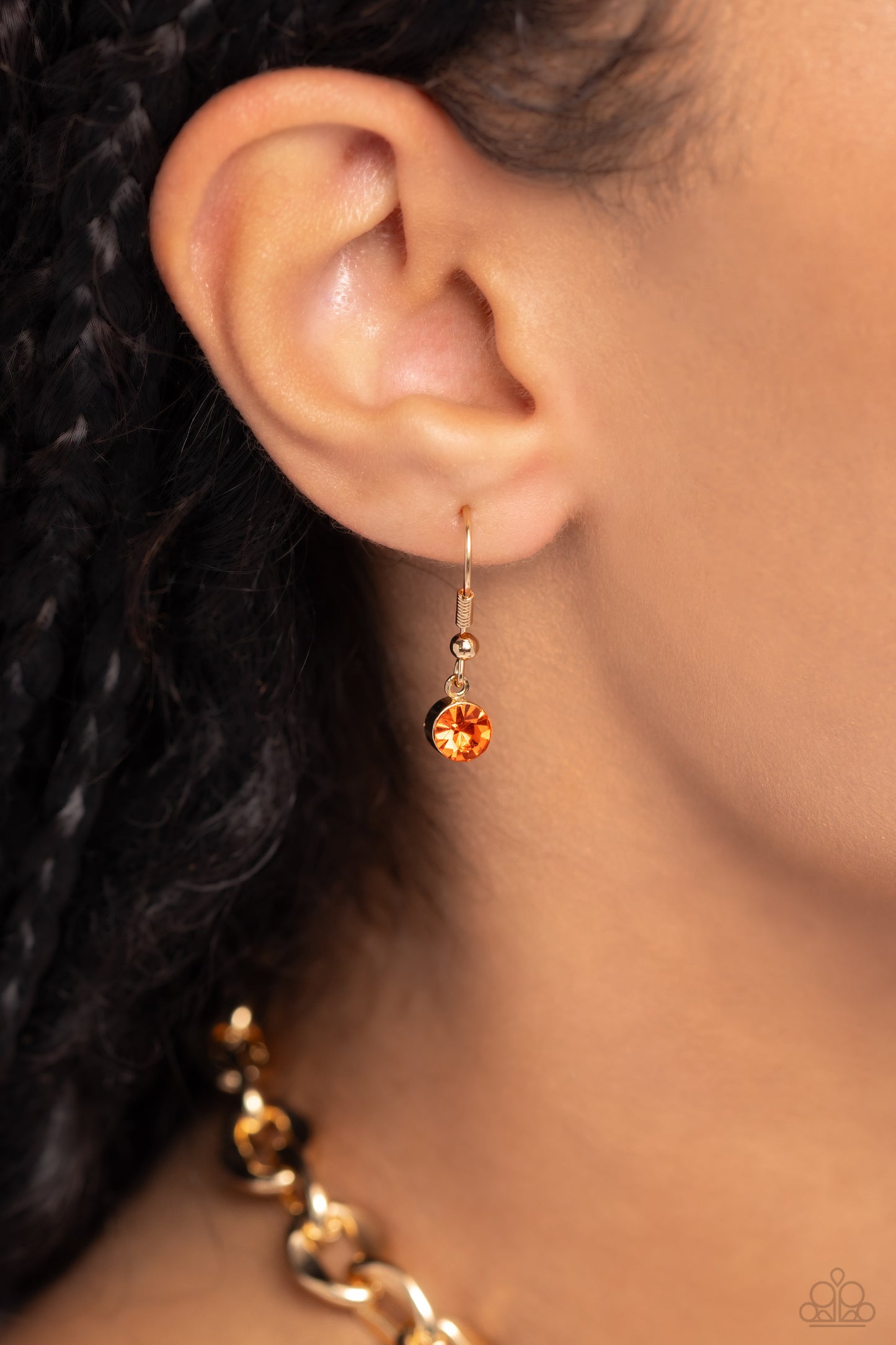 Paparazzi Accessories Benevolent Bling - Gold Set in an elevated gold-pronged frame, a faceted topaz teardrop gem cascades from an oblong, abstract gold ring chain that extends past the collar for a blinding statement. Features an adjustable clasp closure