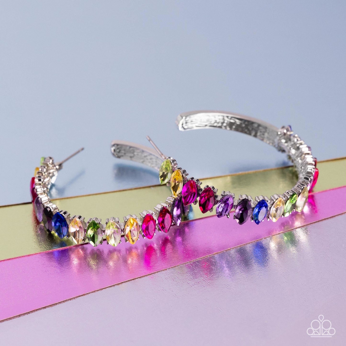 Paparazzi Accessories Rainbow Range - Multi Dazzling colorful marquise-cut gems fall in line along the front edge of a classic silver hoop. The exposed edges create a gritty silhouette, beautifully contrasting with the blinding shimmer of the gems in a st