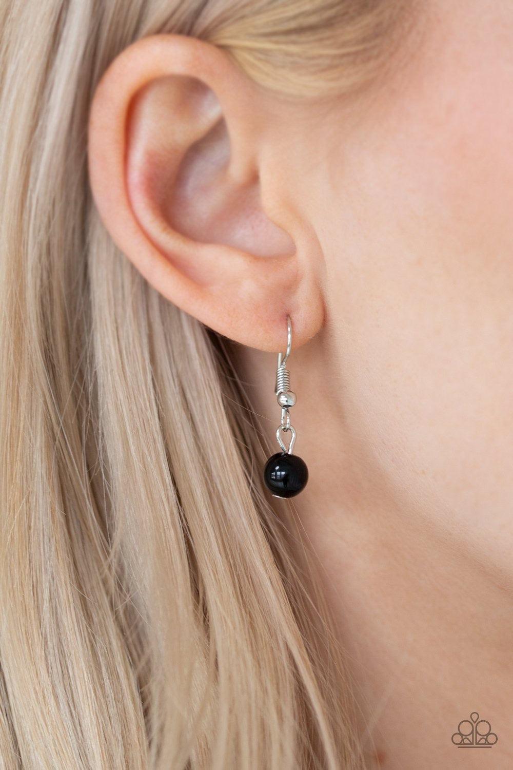 Paparazzi Accessories Regal Refinement - Black Alternating with glassy white rhinestones, shiny black beaded tassels swing from the bottom of a shimmery silver chain below the collar for a refined flair. Features an adjustable clasp closure. Sold as one i