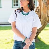 Paparazzi Accessories Modern Macarena - Green Featuring round and teardrop shapes, clusters of faceted Quetzal Green beads swing from the bottom of a shimmery silver chain, creating a playful fringe below the collar. Features an adjustable clasp closure.