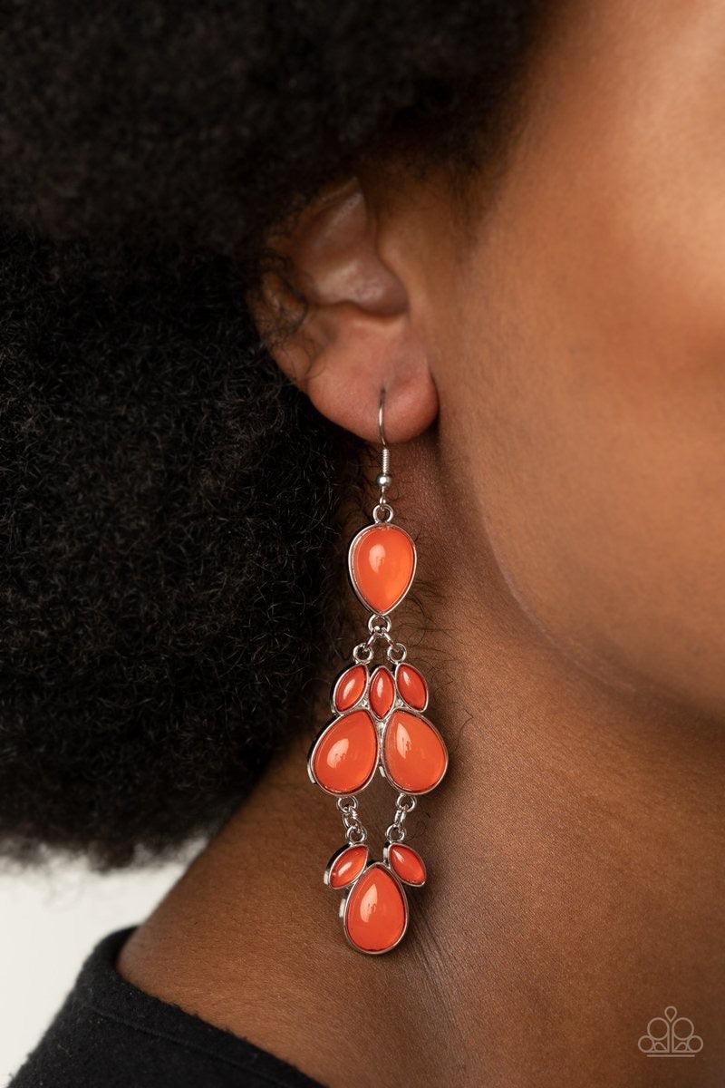 Paparazzi Accessories Super Star Social - Orange Encased in sleek silver fittings, a glassy collection of marquise and teardrop Amberglow beads delicately connect into a dramatically colorful lure. Earring attaches to a standard fishhook fitting. Jewelry
