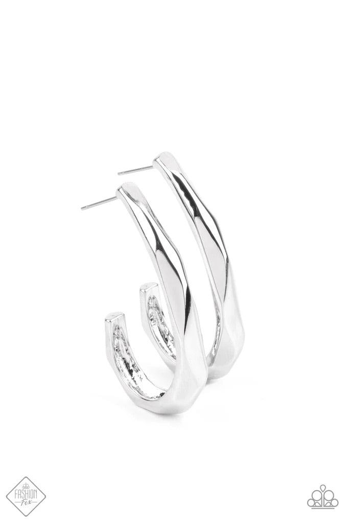 Paparazzi Accessories Made You HOOK - Silver The surface of a J-hook shaped silver hoop is faceted in a flashy finish that reflects and refracts the light for an edgy shimmer. Earring attaches to a standard post fitting. Hoop measures approximately 1" in