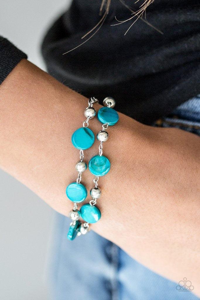 Paparazzi Accessories One Bay At A Time - Blue Brushed in a shell-like shimmer, iridescent blue beads and dainty silver beads link around the wrist for a seasonal look. Features an adjustable clasp closure. Jewelry