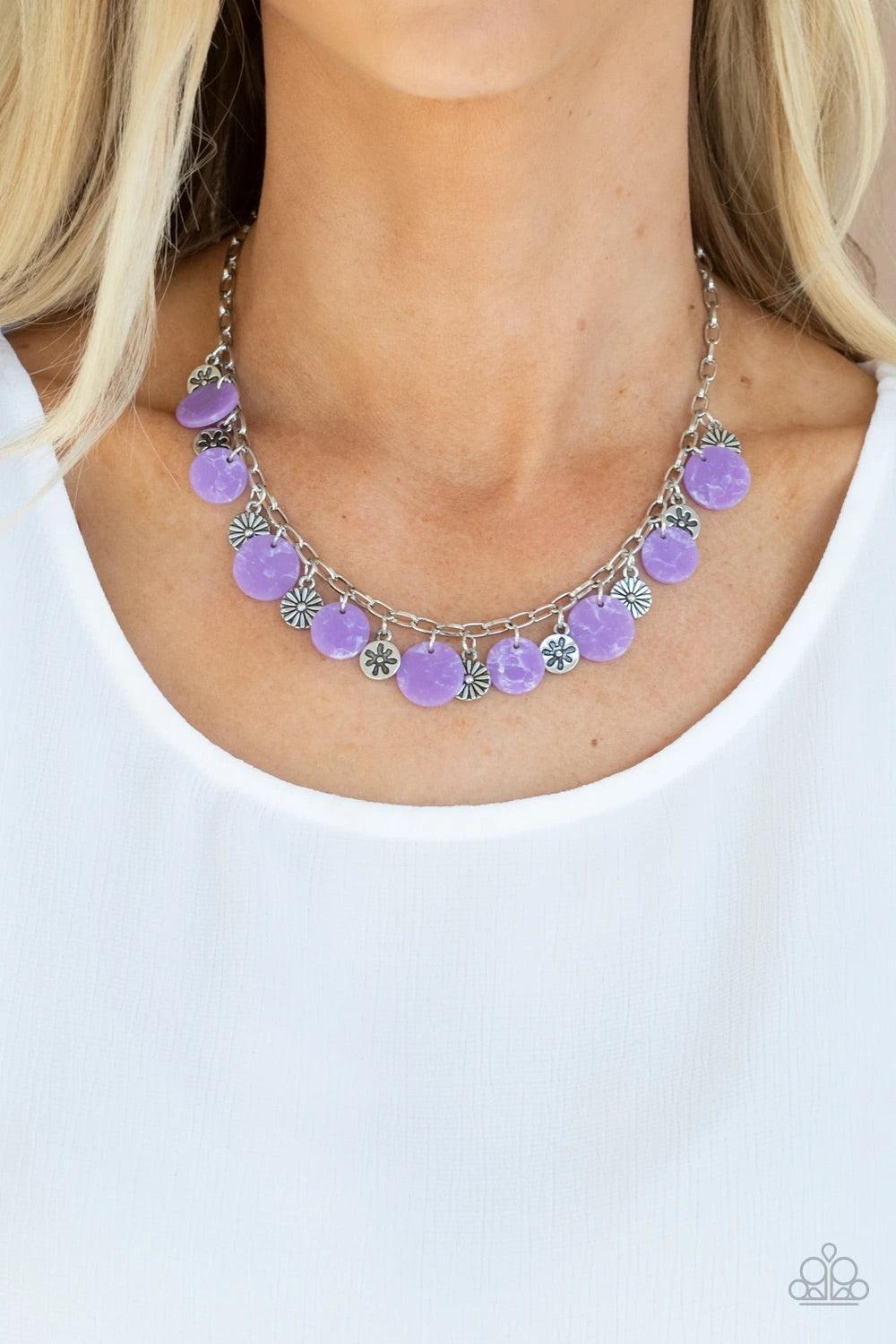 Paparazzi Accessories Flower Powered ~Purple A whimsical collection of mismatched silver floral charms and purple acrylic discs swing from a silver chain, creating a vivacious fringe below the collar. Features an adjustable clasp closure. Sold as one indi