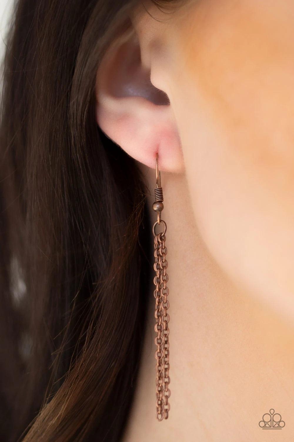 Paparazzi Accessories From Sunup To Sundown - Copper A textured sunburst pendant swings from the bottom of a lengthened copper chain. A shimmery copper chain tassel swings from the bottom of the tribal inspired pendant for a seasonal finish. Features an a