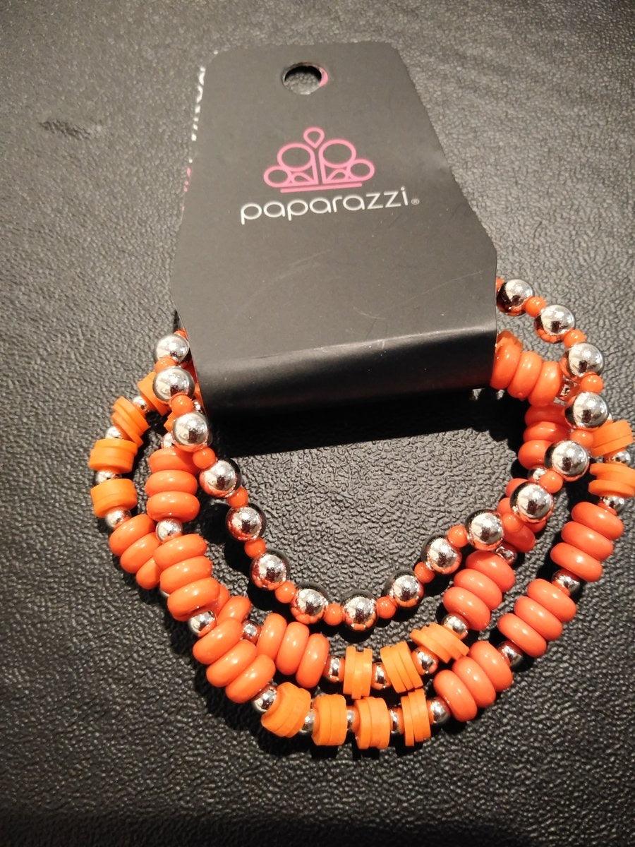 Paparazzi Accessories Tenaciously Tenacious - Orange A variety of Orange and dainty silver beads are threaded along stretchy elastic bands, creating colorful layers across the wrist. Jewelry