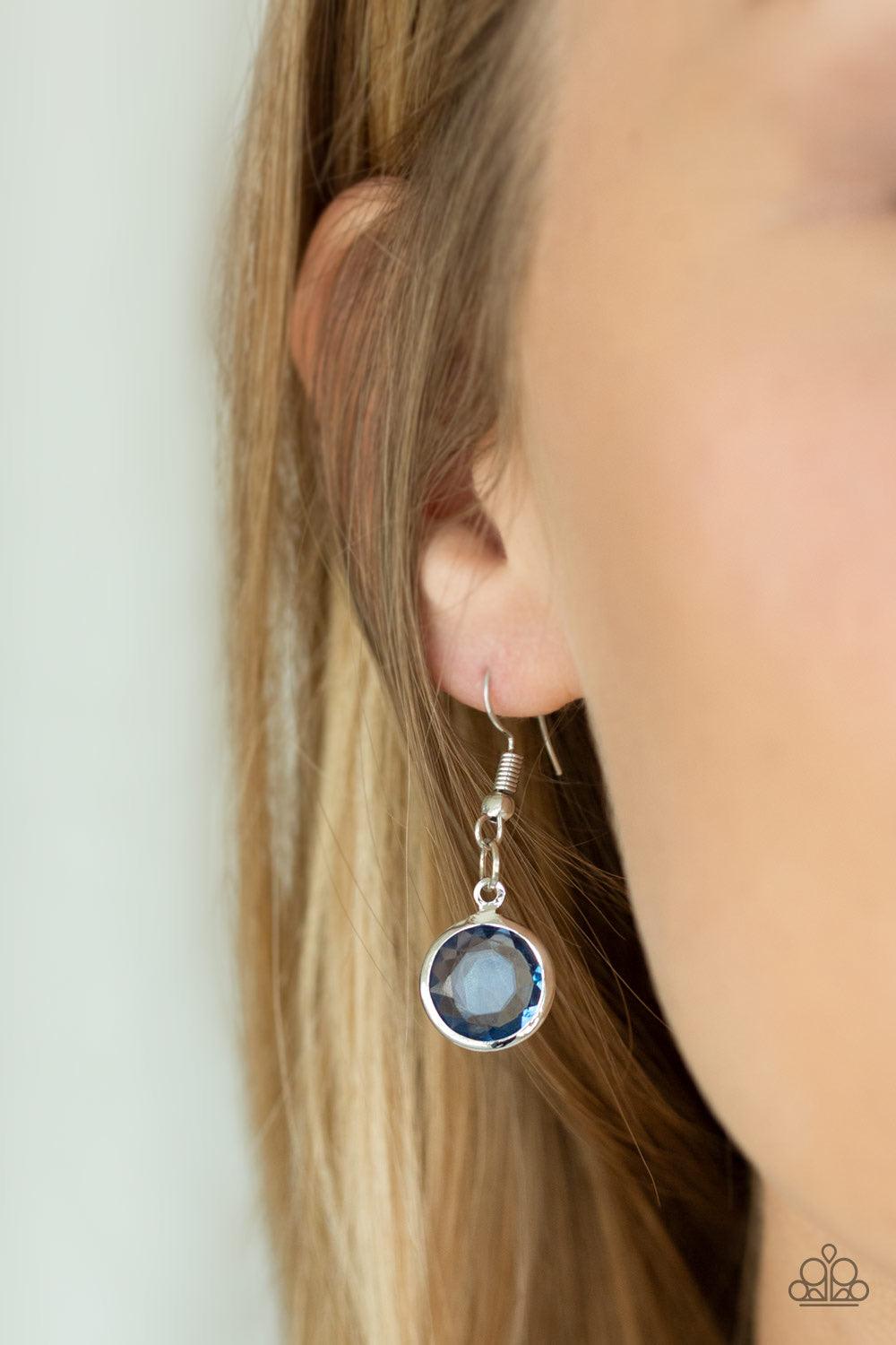 Paparazzi Accessories Glassy Glamorous - Blue Featuring sleek silver fittings, an array of glassy Blue Depths gemstones trickle along a shimmery silver chain for a glamorous look. Features an adjustable clasp closure. Sold as one individual necklace. Incl