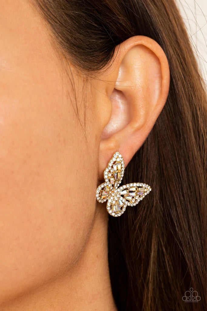 Paparazzi Accessories Smooth Like FLUTTER - Gold Bordered in dainty white rhinestones, emerald cut iridescent rhinestones sparkle inside the gold wings of a butterfly for an enchanting fashion. Earring attaches to a standard post fitting. Sold as one pair