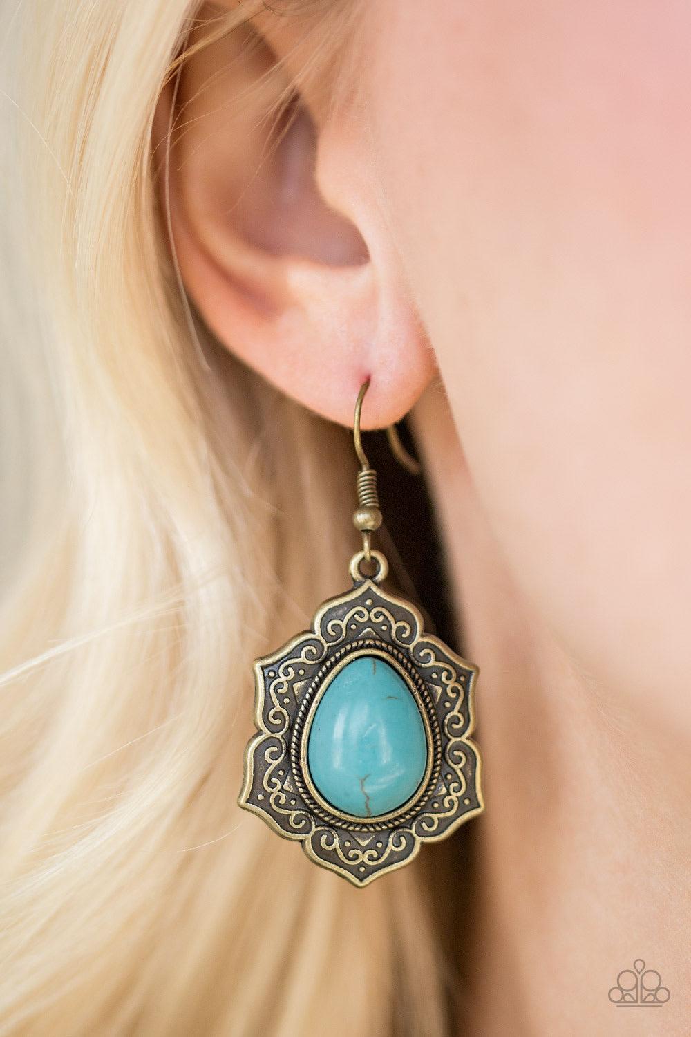 Paparazzi Accessories So Santa Fe - Brass Decorative brass petals spin around a refreshing turquoise stone center for a seasonal look. Earring attaches to standard fishhook fitting. Sold as one pair of earrings. Jewelry