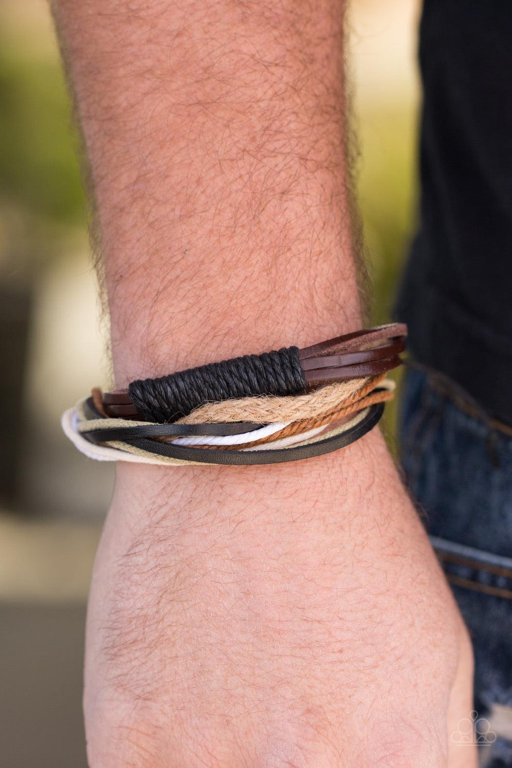 Paparazzi Accessories Forest Guide - Brown A mishmash of multicolored cording and black and knotted brown leather bands layer across the wrist for a rugged look. Features an adjustable sliding knot closure. Sold as one individual bracelet. Jewelry