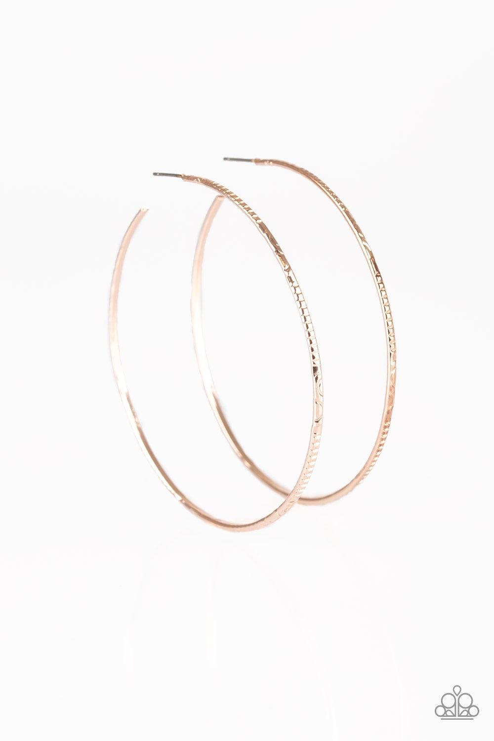 Paparazzi Accessories Sleek Fleek - Rose Gold Etched in mismatched textures, a dainty rose gold bar curls into a patterned hoop for a seasonal look. Earring attaches to a standard post fitting. Hoop measures 2 3/4" in diameter. Jewelry