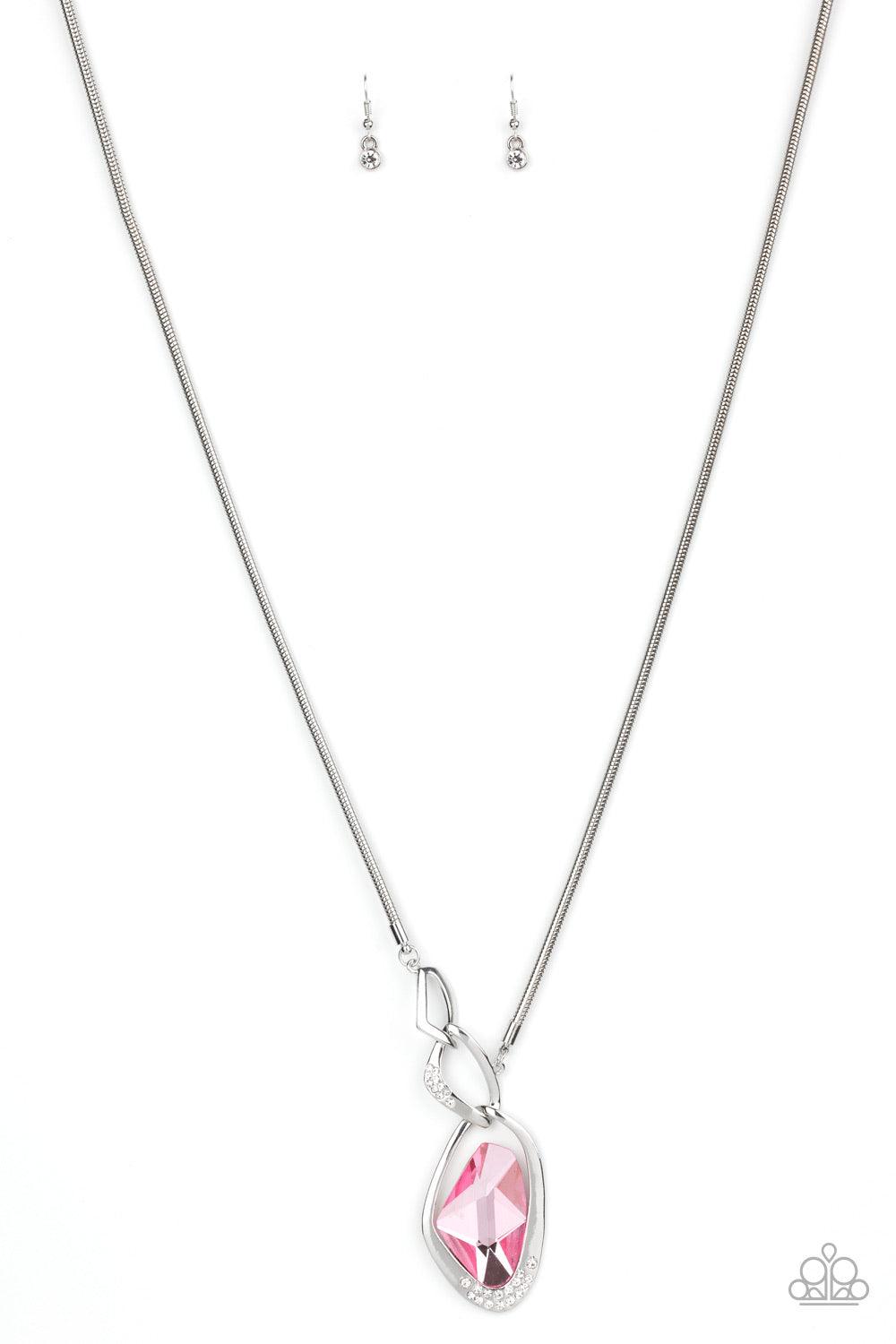 Paparazzi Accessories Optical Opulence - Pink A faceted pink gem is nestled inside of a shimmery silver frame encrusted in dainty white rhinestones. The glittery pendant asymmetrically links with abstract silver frames at the bottom of a lengthened silver