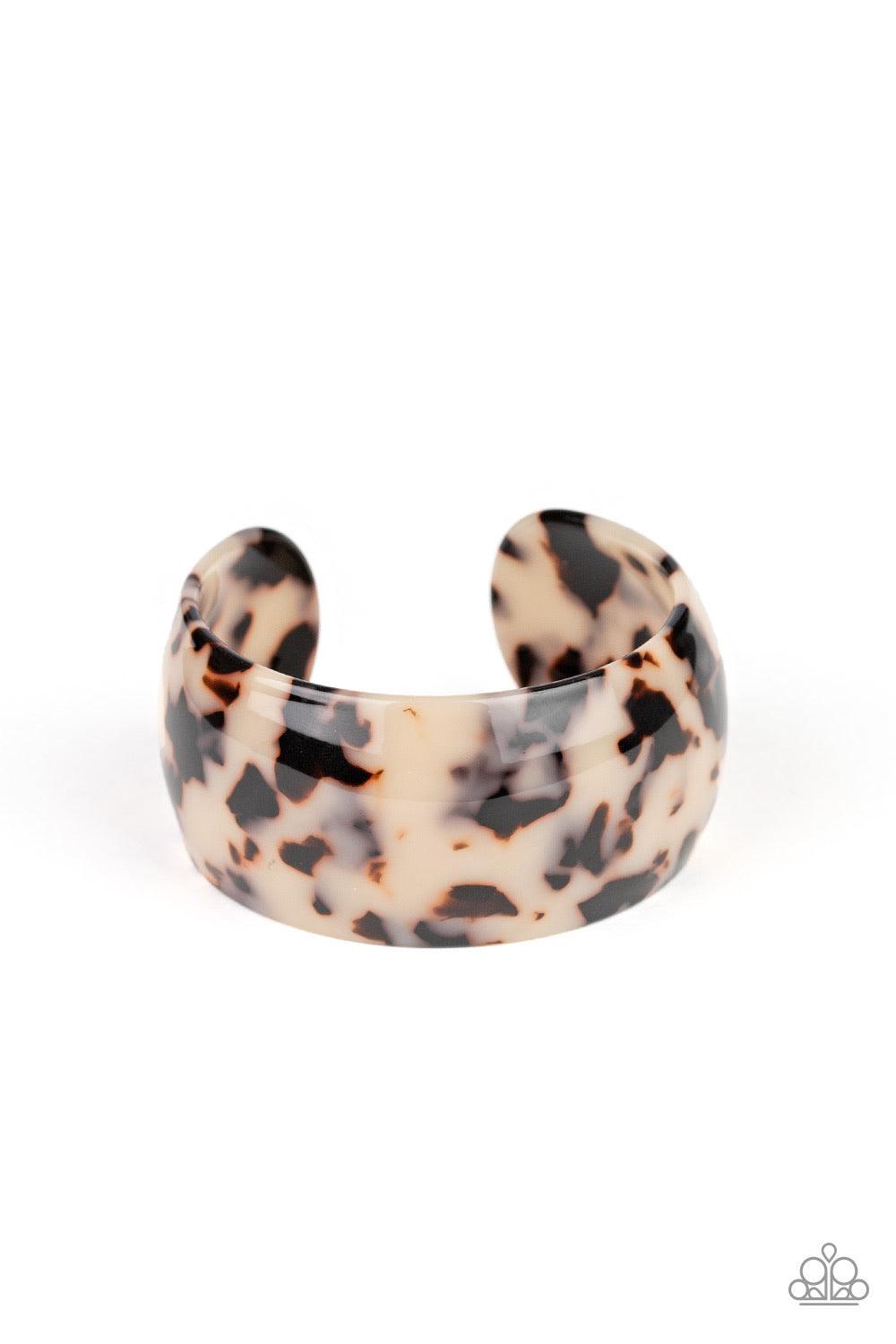 Paparazzi Accessories Jungle Cruise - White Featuring brown and white tortoise shell, a thick acrylic cuff curls around the wrist for a wildly retro fashion. Jewelry
